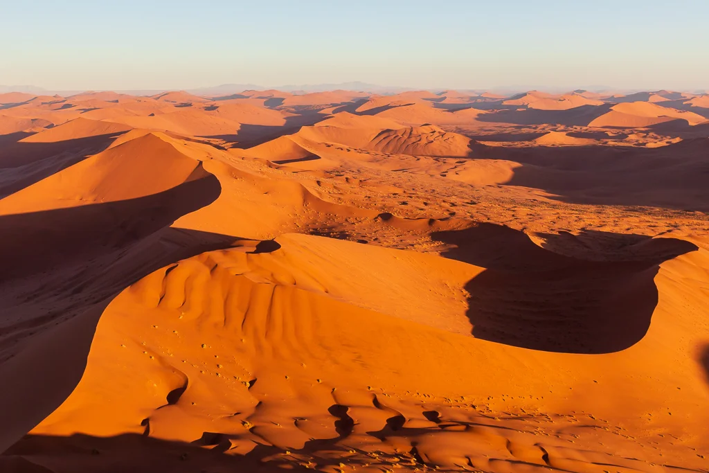 Red ocre-colored iron-rich sand dunes
