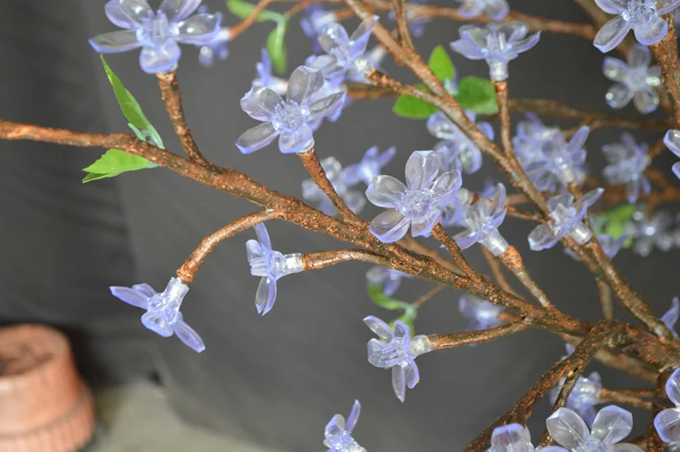 the warm white blossom light tree with its natural trunk is also ideal for garden themed events, however its warm white led lights help create a more intimate atmosphere, making it perfect for smaller venues, wedding receptions and interior projects.