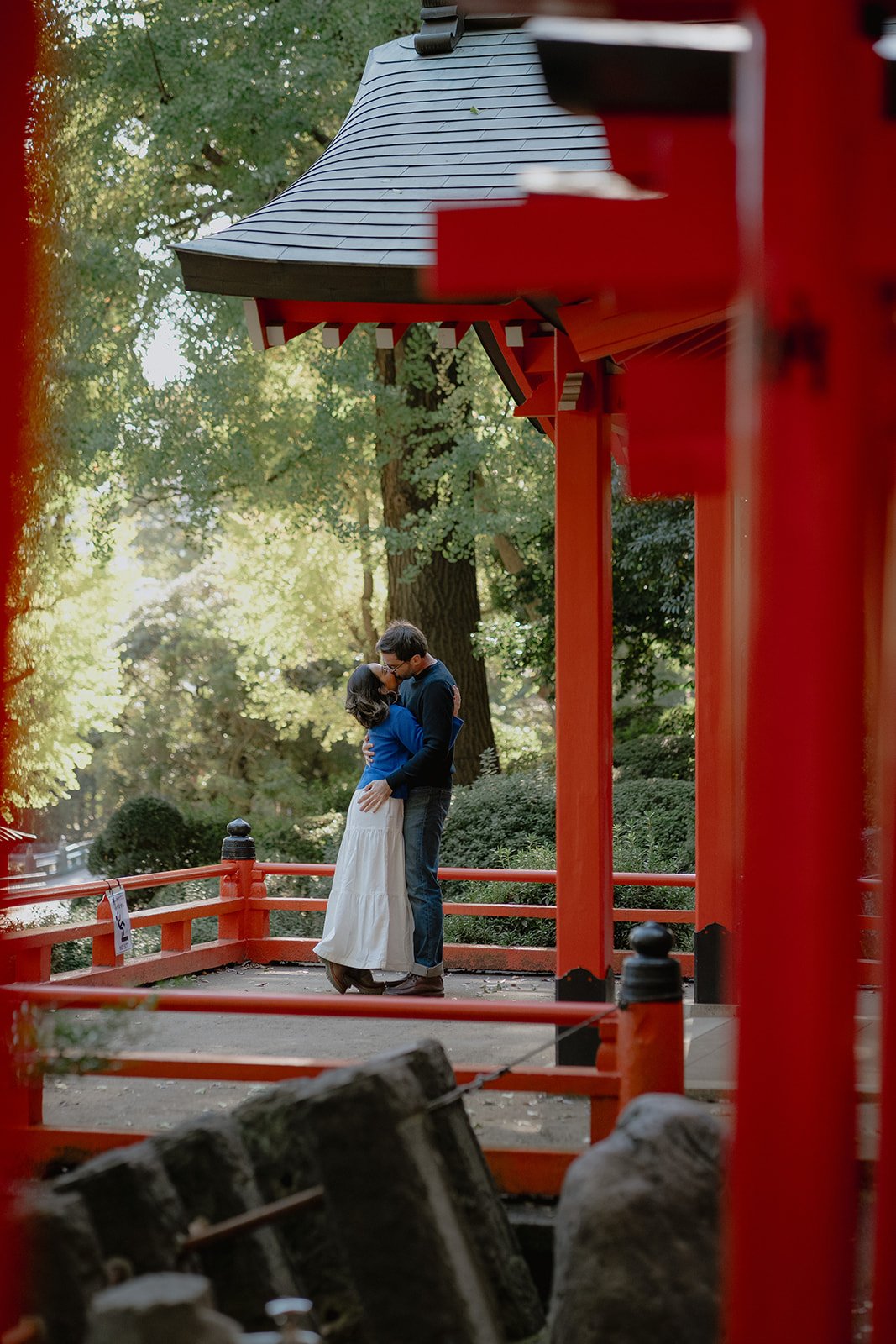 A newly engaged couple photographed at a shrine