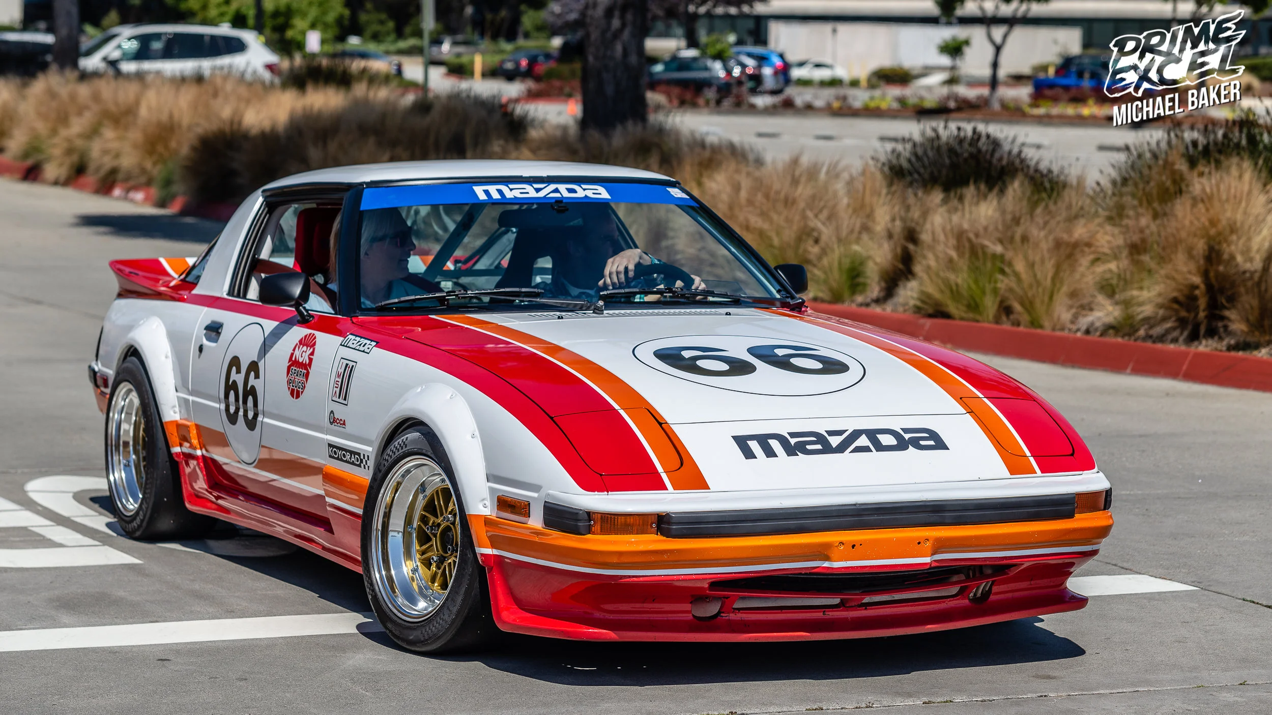 This FB Mazda RX-7 exemplifies styling of a bygone era with pop-up headlights, thin pillars, small wheels and a period-correct livery.