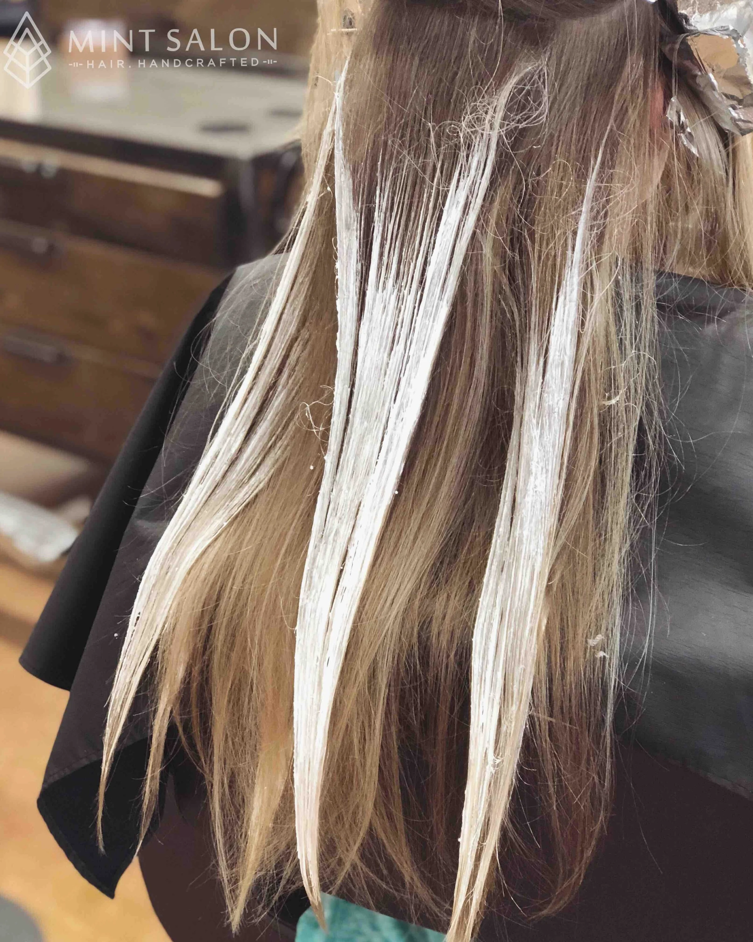 Hand painted or balayage highlights using Davines Century of Light Liberty lightner..