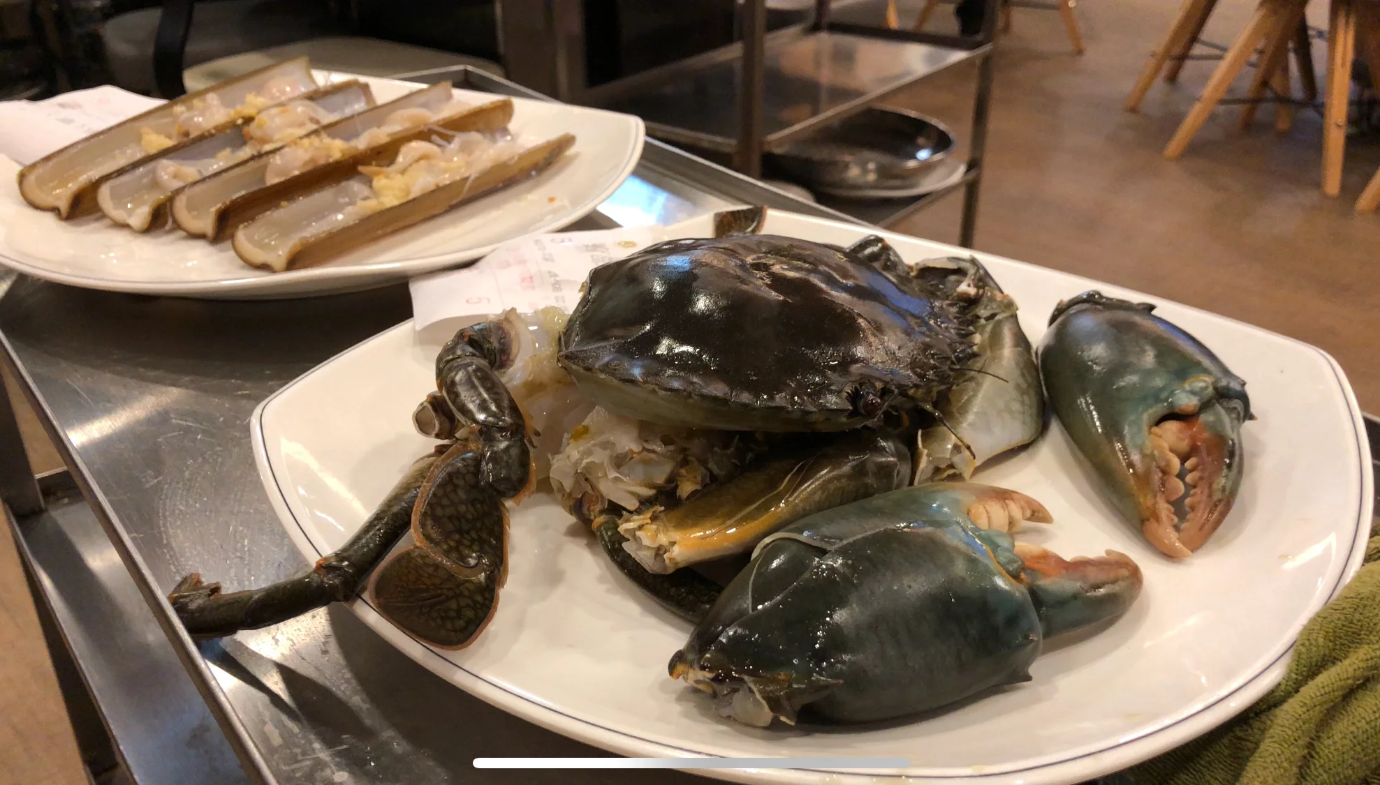 After cleaning the seafood, they wheel it back to your table.