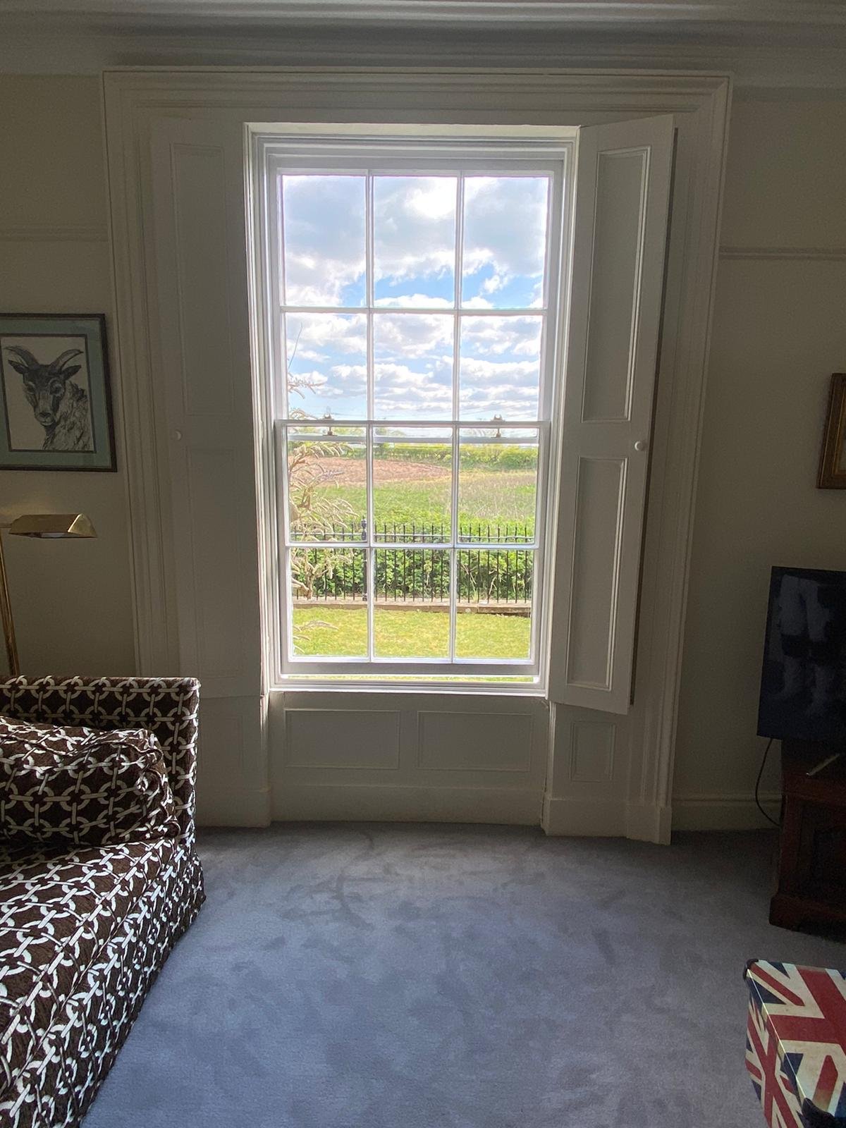 Refurbished sash window with decoration pane in the sash.jpeg