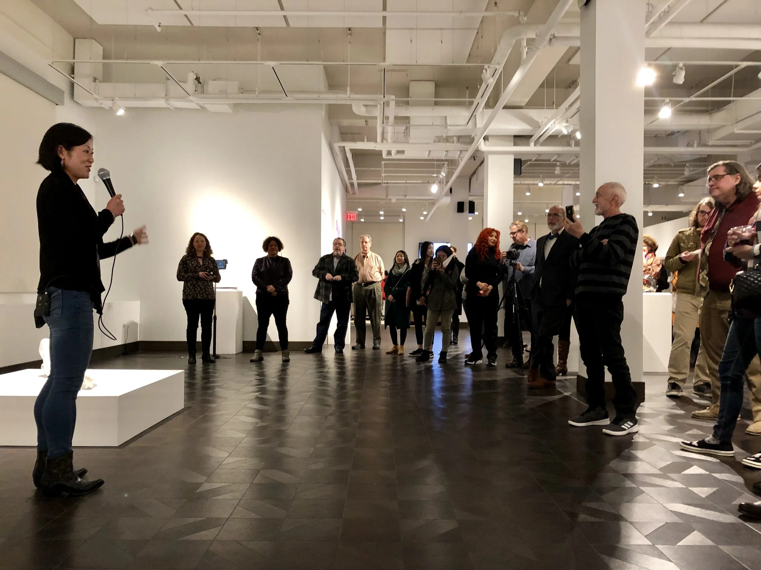 Mari Ogihara giving an artist talk for Enamored Armor at Rowan University, curated by Amie Potsic