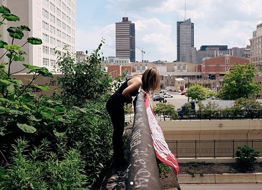 Aubrie Costello installing her silk graffiti