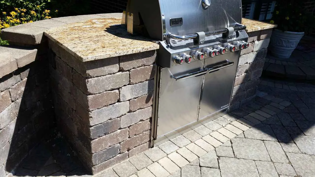 Outdoor kitchen installed by landscape contractor in Riverside, IL