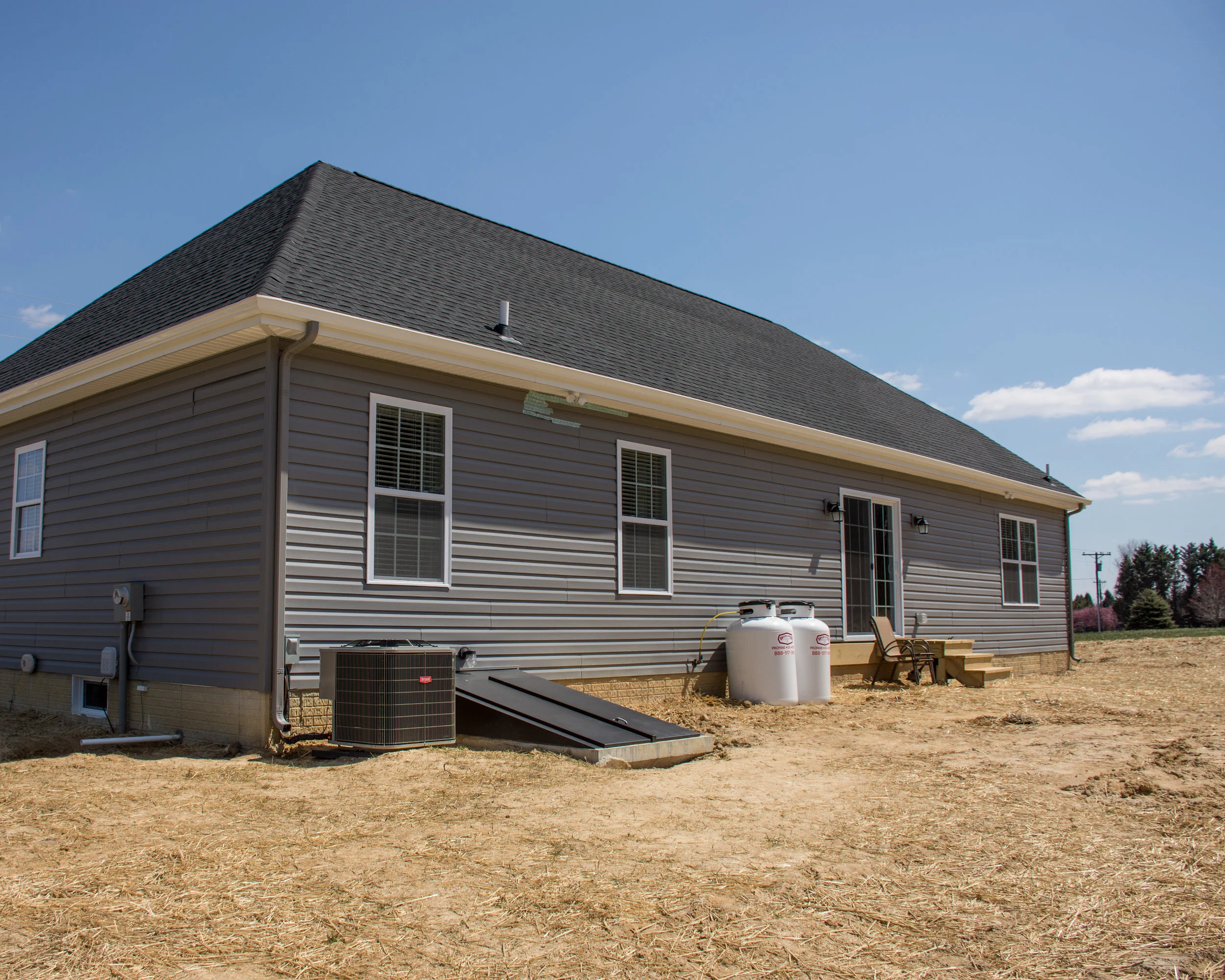 House Rear Vinyl Siding New Roof