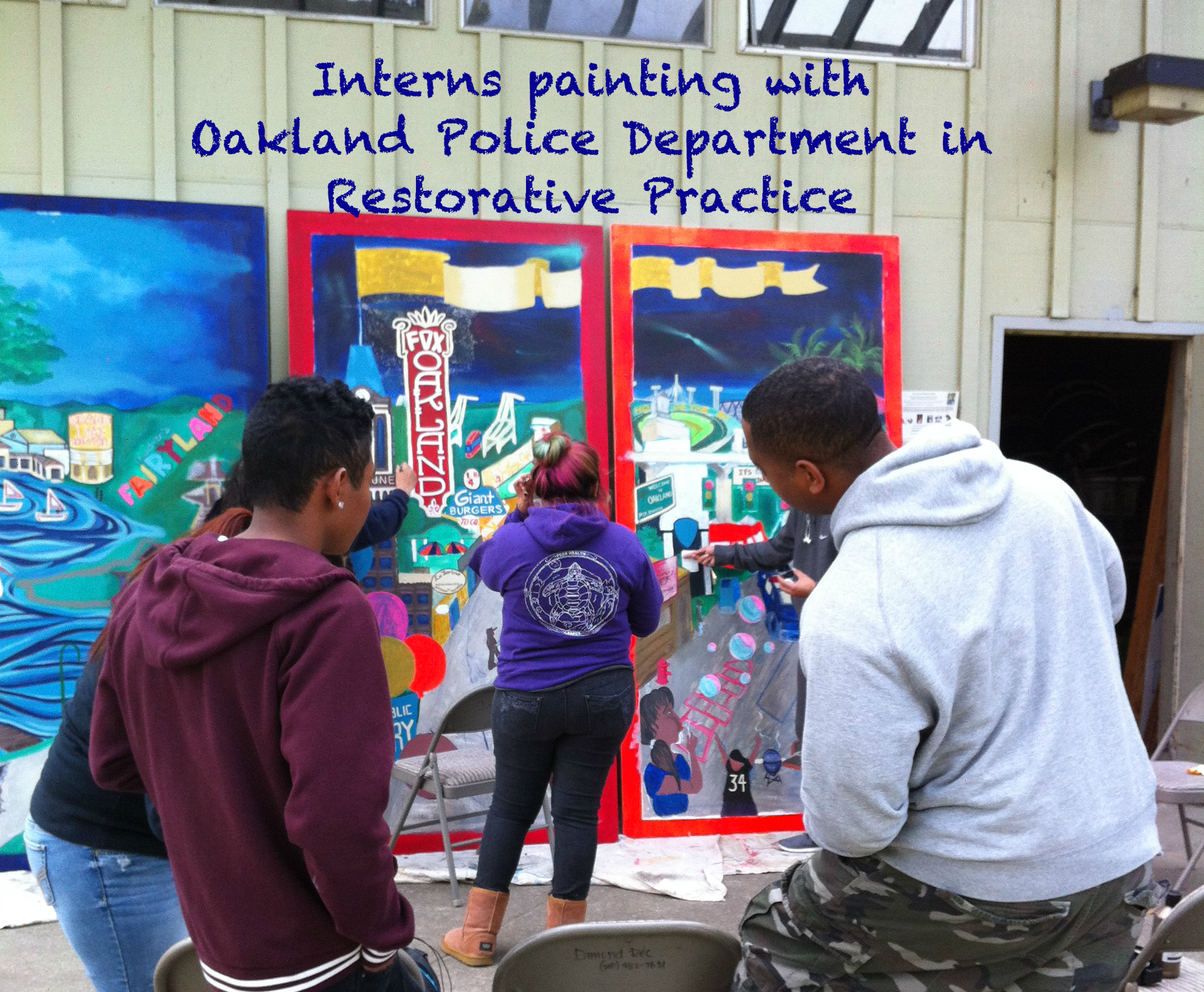 RPSC interns painting with Oakland Police Department in Restorative Practice 2.jpg