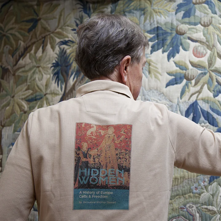 The beautiful full-color cover image on the back of the shirt modeled by Blair