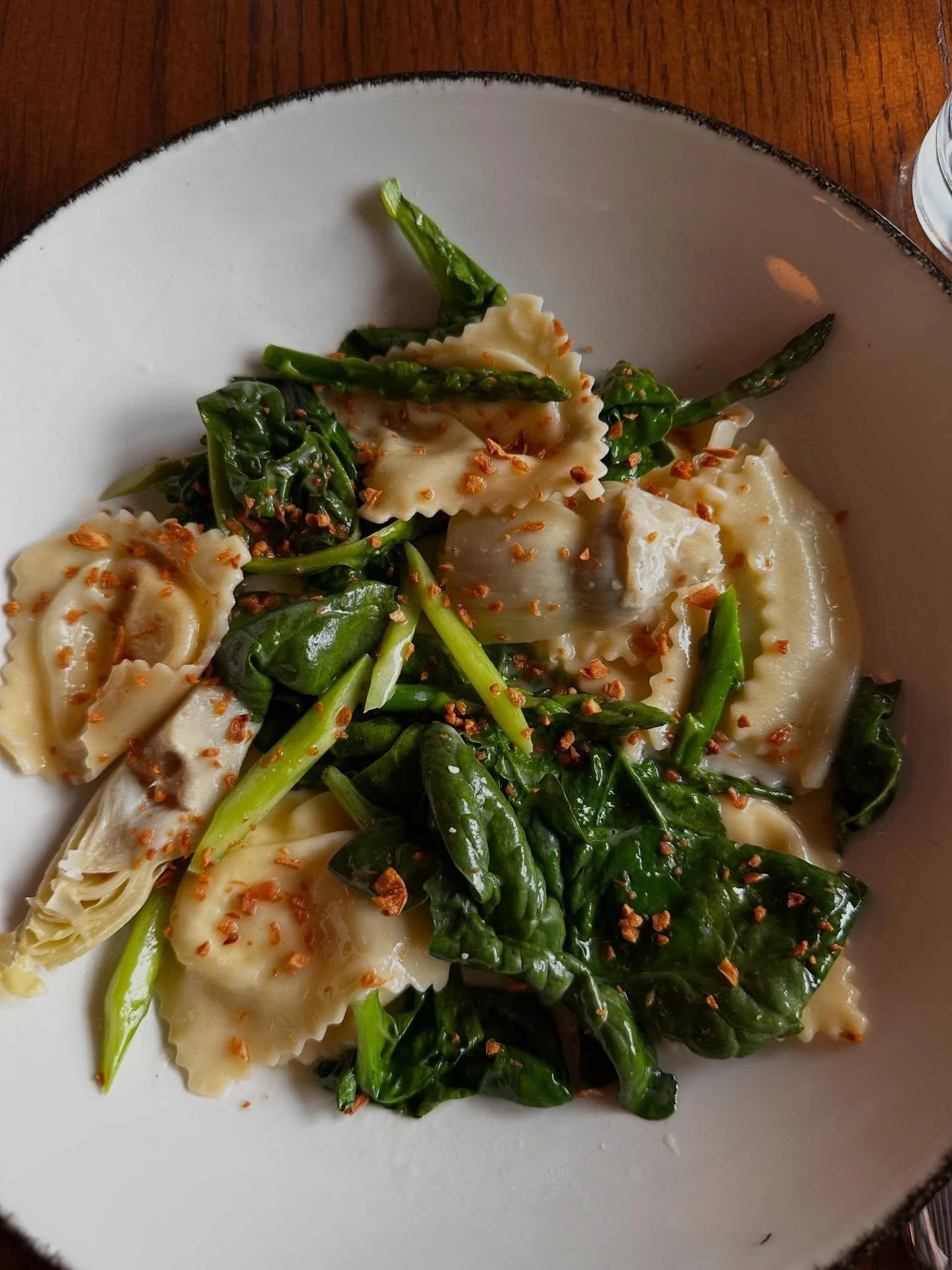 💥another springtime banger just dropped! local asparagus and spinach bring the vibes to this house made ravioli stuffed to the max with ricotta, mascarpone, Parmesan and fennel pollen! The hype is real!