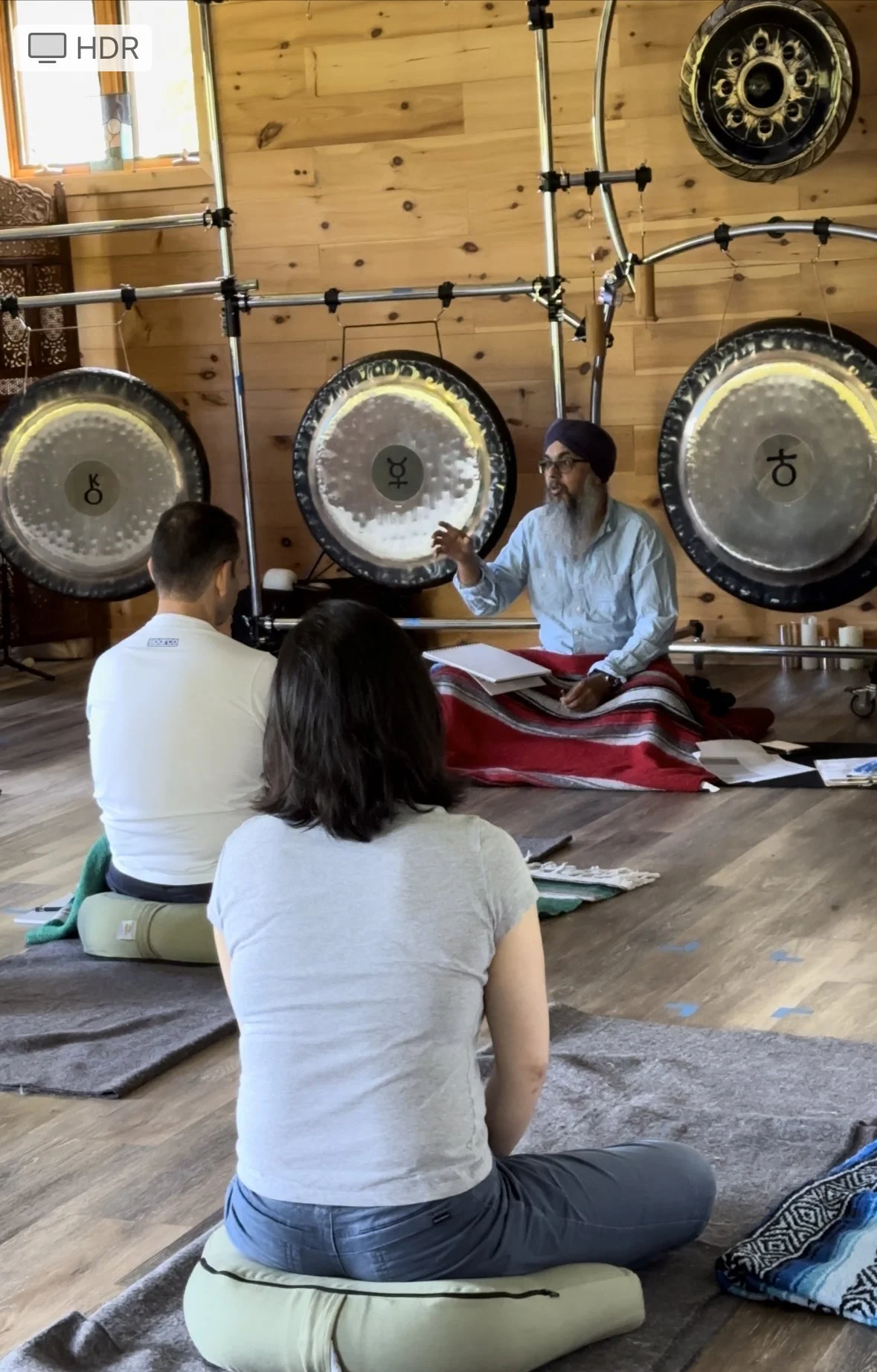 Guided gong meditation during a meditation retreat at Setu Vermont in Brattleboro, Vermont.