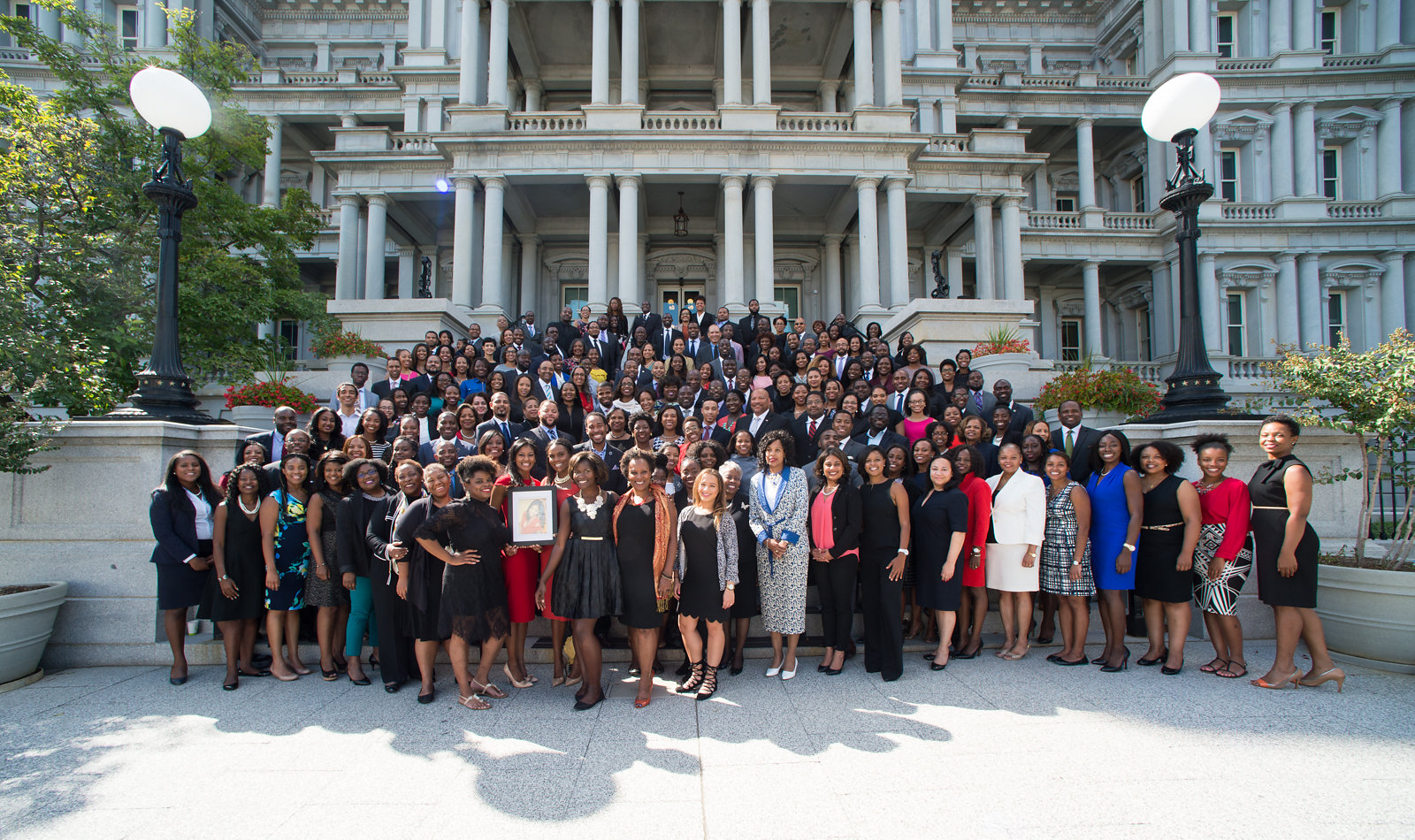 Obama Administration Alumni in front of the White House EOB