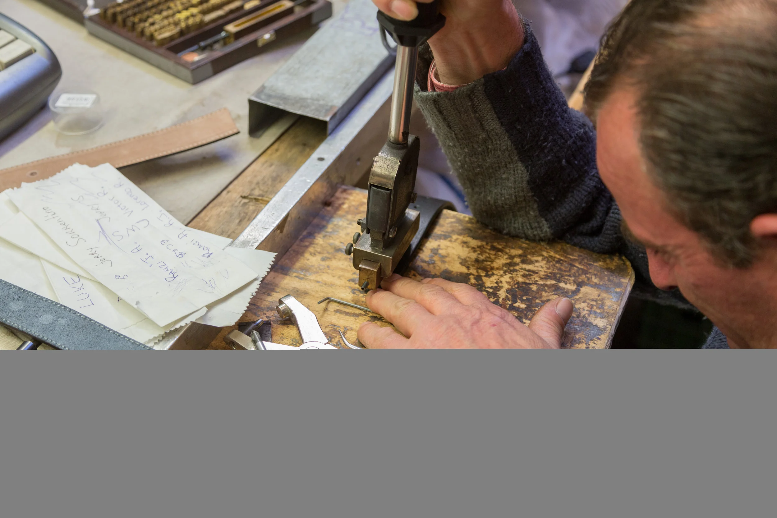 We visited the San Lorenzo Market for gifts to bring home. Pictured here is a stall owner, pressing my father in law's initials into the leather belt we picked out for him.