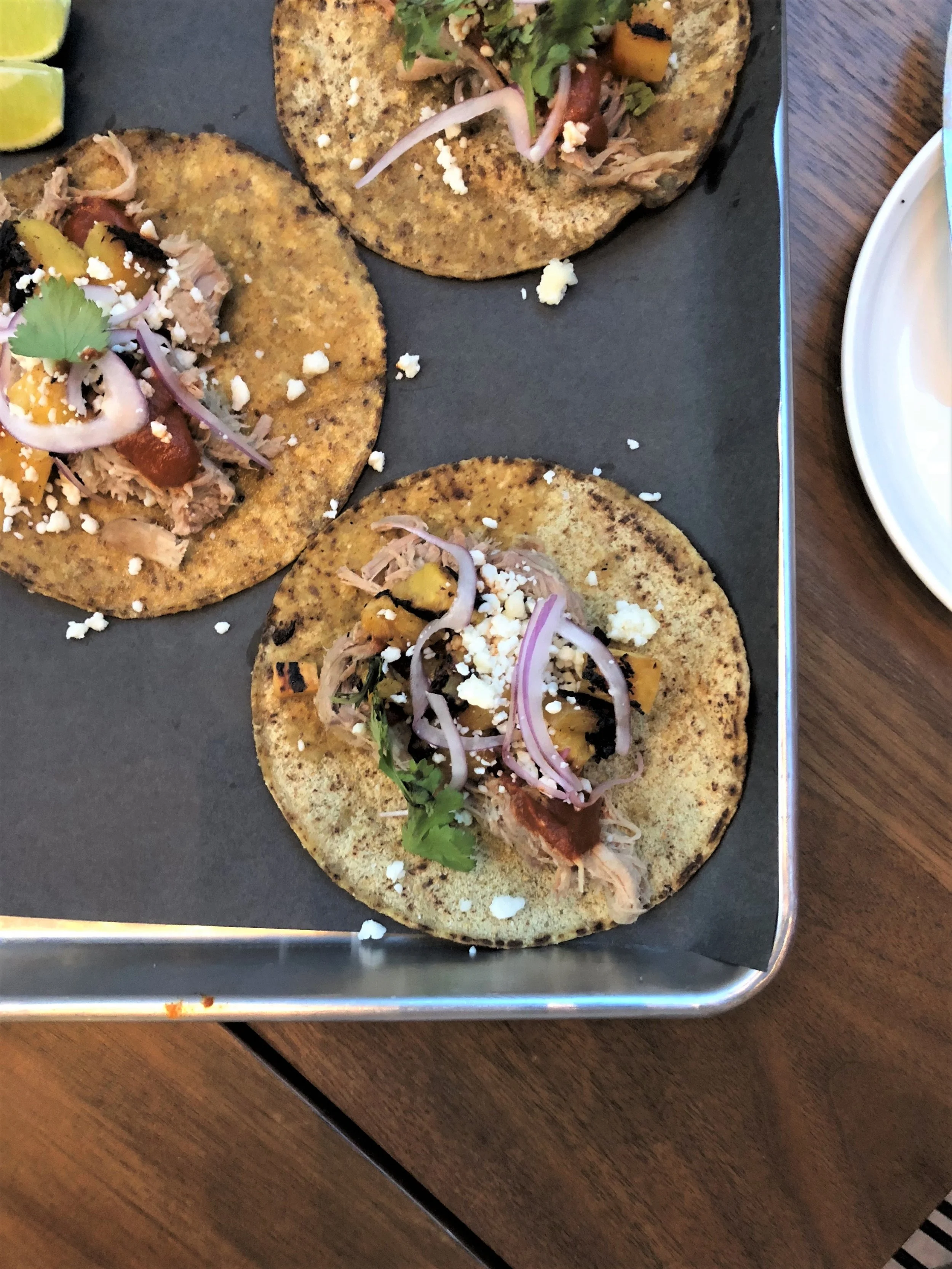 These braised pork tacos with grilled pineapple, queso fresco, onion and cilantro. All I am going to say is O.M.G.