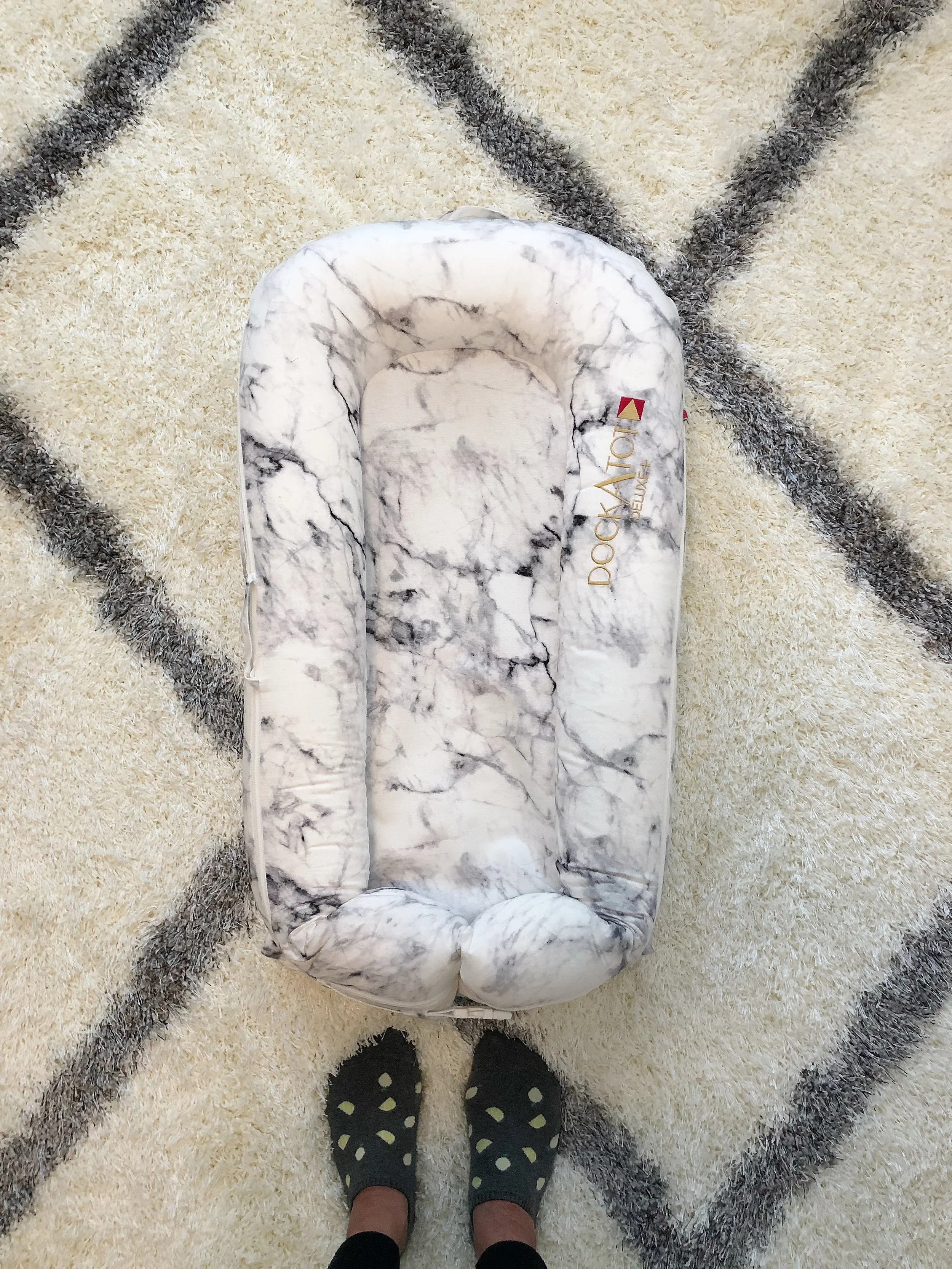 The DockATot was one item that a handful of moms had recommended to me. They and their baby love it. Intrigued, I did some of my own research. What is the DockATot you ask? It’s a multi-functional lounger, co-sleeper and playtime lounger. It’s handmade in Europe, all natural and 100% cotton. It’s also lightweight and easy to travel with. The DockATot creates an ideal micro-climate (space directly affecting the baby’s surrounding) for babies. Based on the positive recommendations and its multi-use, I was super excited to get one for Baby Rubin. The DockATot comes in two sizes, the Deluxe+ (0-8 months) and Grand Dock (9-36 months). It comes in plenty of fun patterns. I went with the cararra marble print in the Deluxe+. Can’t wait to see how much Baby Rubin will enjoy it! (Although I received this DockATot Deluxe+ compliments of DockATot, opinions are my own.)