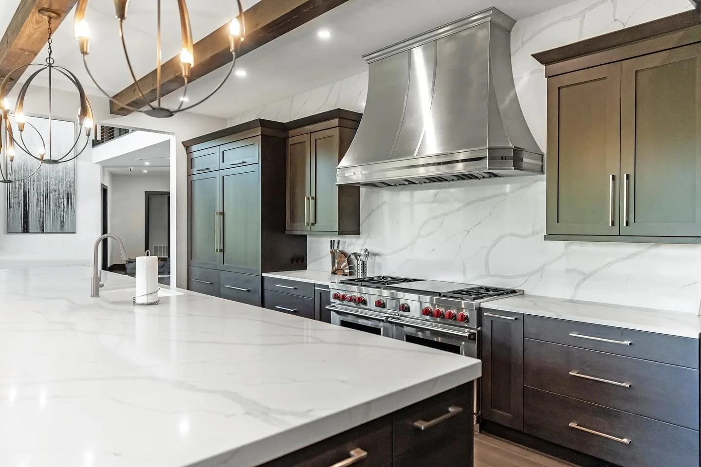 When the quartz slab is so stunning, you want to use it everywhere!

This kitchen is a true showstopper &mdash; featuring a gorgeous custom metal hood that adds sleek elegance. Paired perfectly with fabulous Wolf appliances, it&rsquo;s a chef&rsquo;s