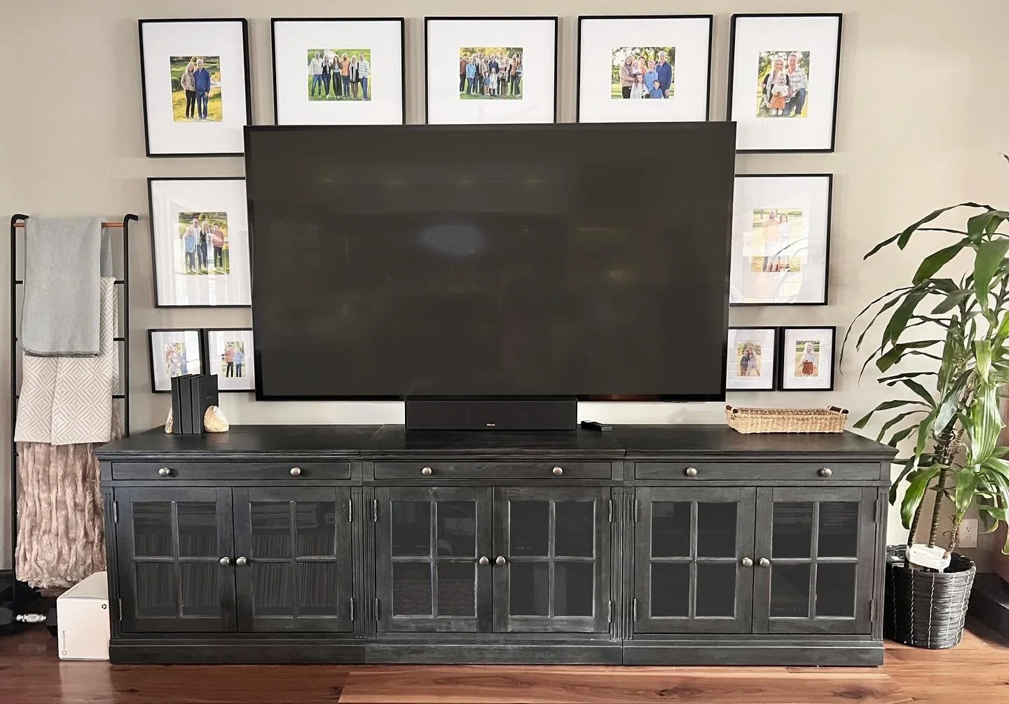 I love hanging gallery walls around TVs! It adds so much scale and creates a beautiful focal point&mdash;perfect for when you&rsquo;re watching commercials or when the TV is off. Just a quick tip: make sure your media stand is wider than your TV to k