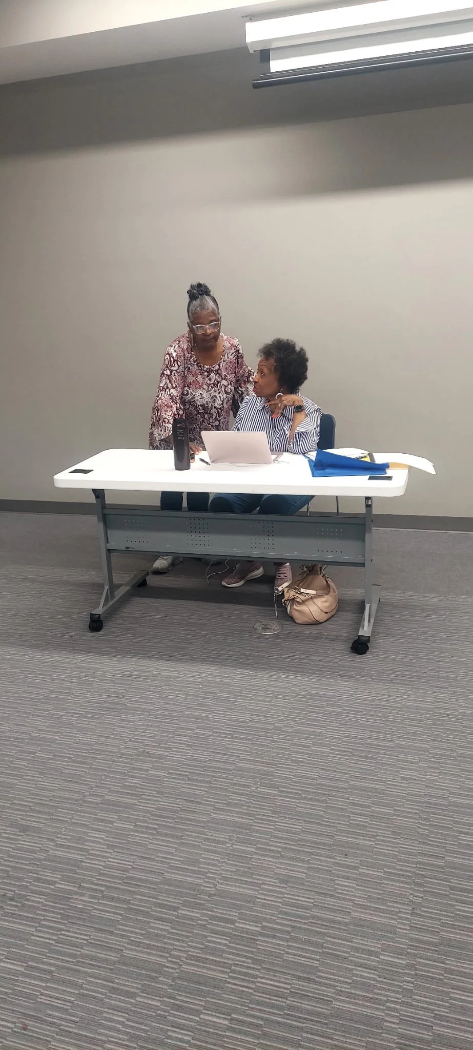  LCDWC members Sherry &amp; Valerie work together on their calling lists. 