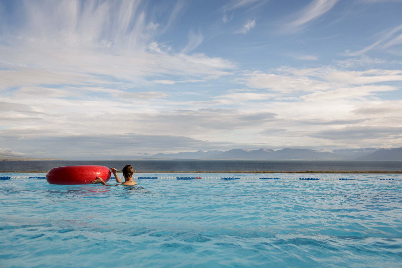  A boy swims in a pool built overlooking the sea in Hofsos. 