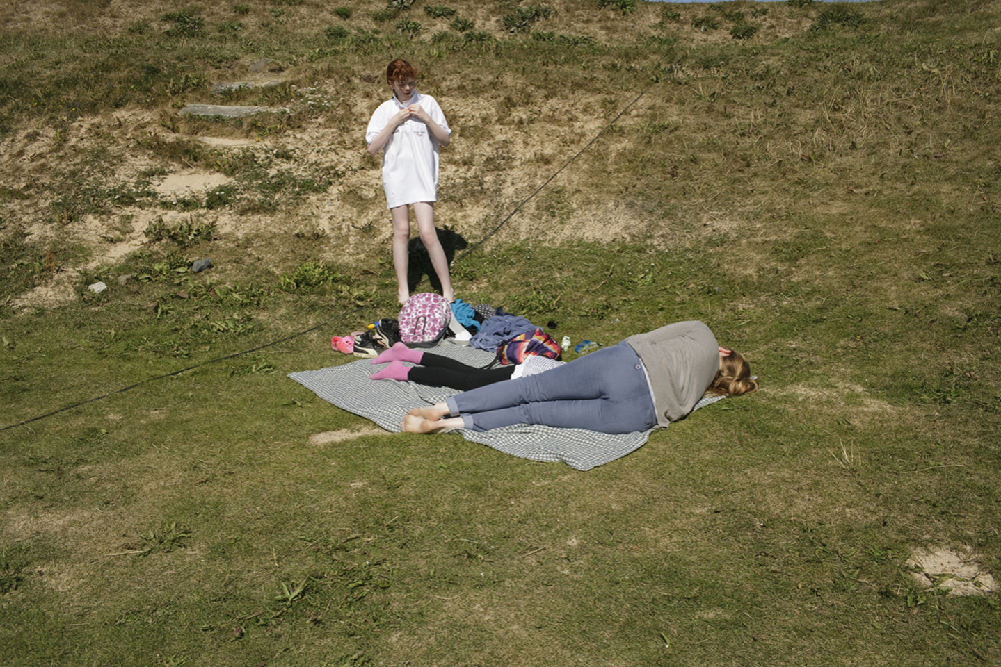  Beachgoers lounging on the banks of Nauthólsvík Geothermal Beach in Reykjavik on the first day of August. 