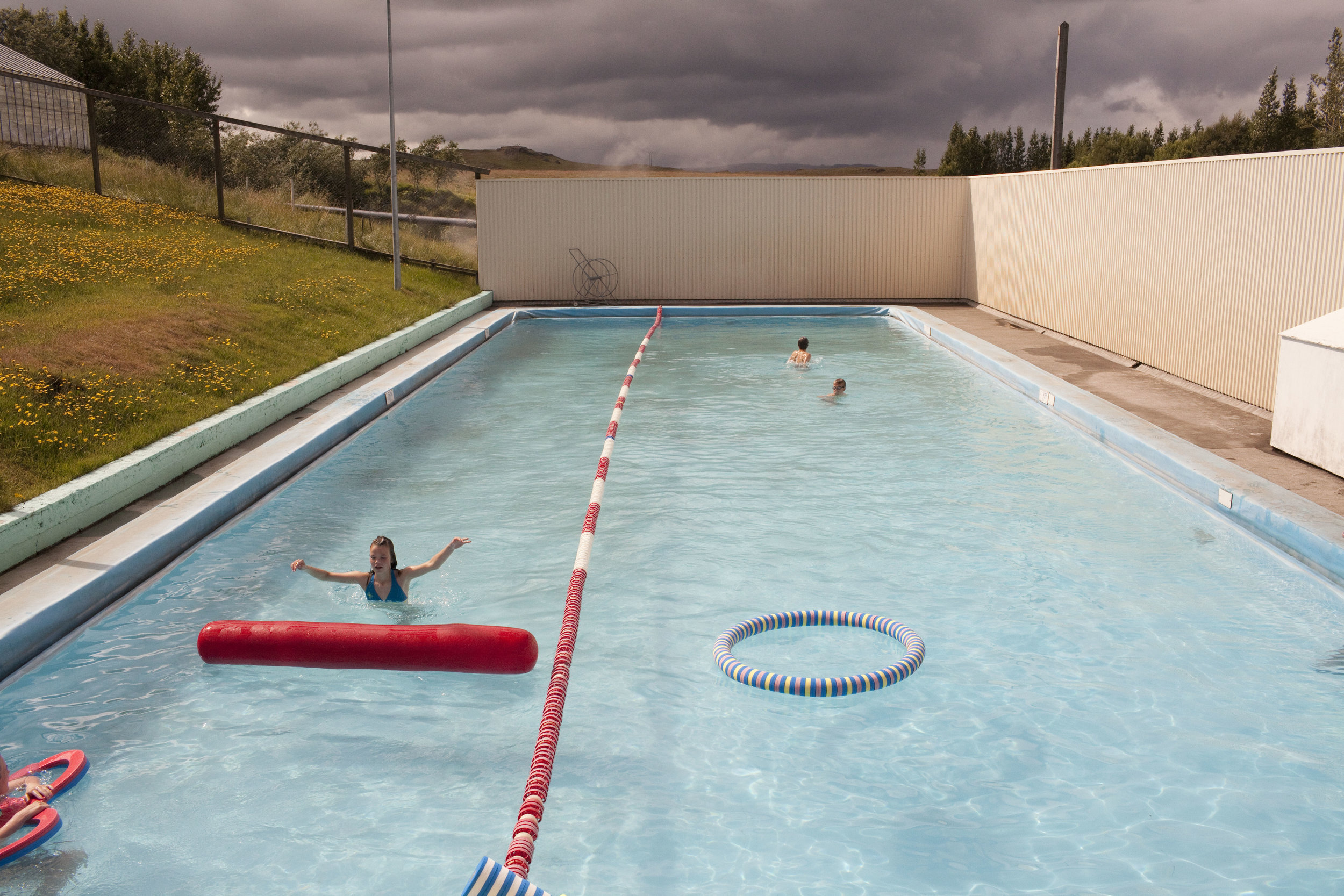 At the community pool in Fludir, Iceland. The small town of about 400 people is situated in the mountains and its scenery makes it a popular vacation spot for many Icelanders in the summer months.