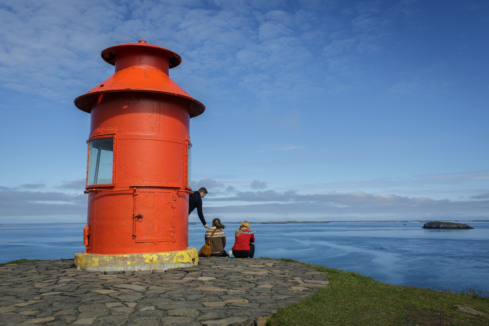  A lighthouse seems to stand at the edge of the world in Stykkishólmur, on the western coast of Iceland in the Snæfellsnes peninsula. 