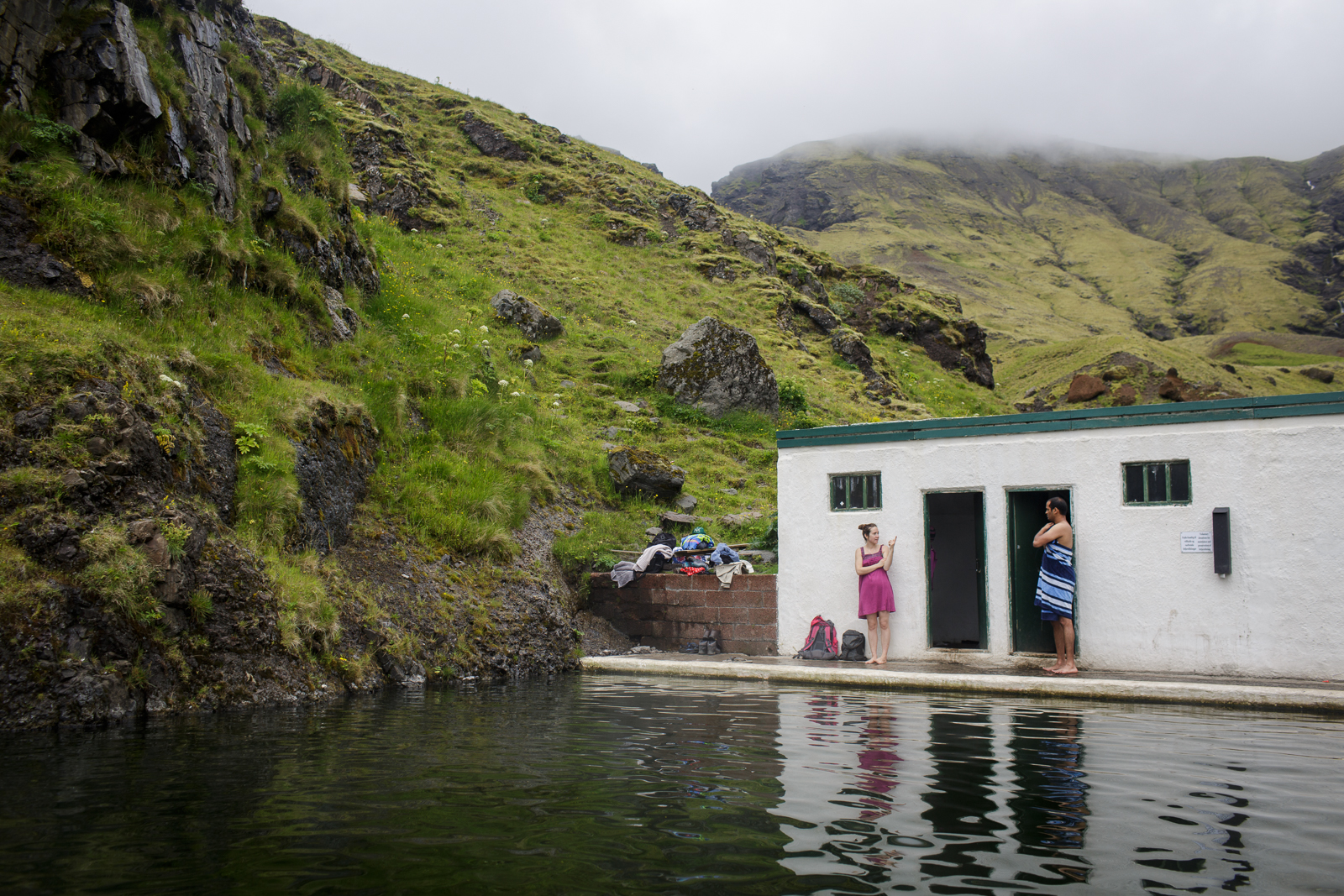  Guests dry off at Seljavallalaug, an outdoor swimming pool built in 1923, nestled in the mountains of southern Iceland. 