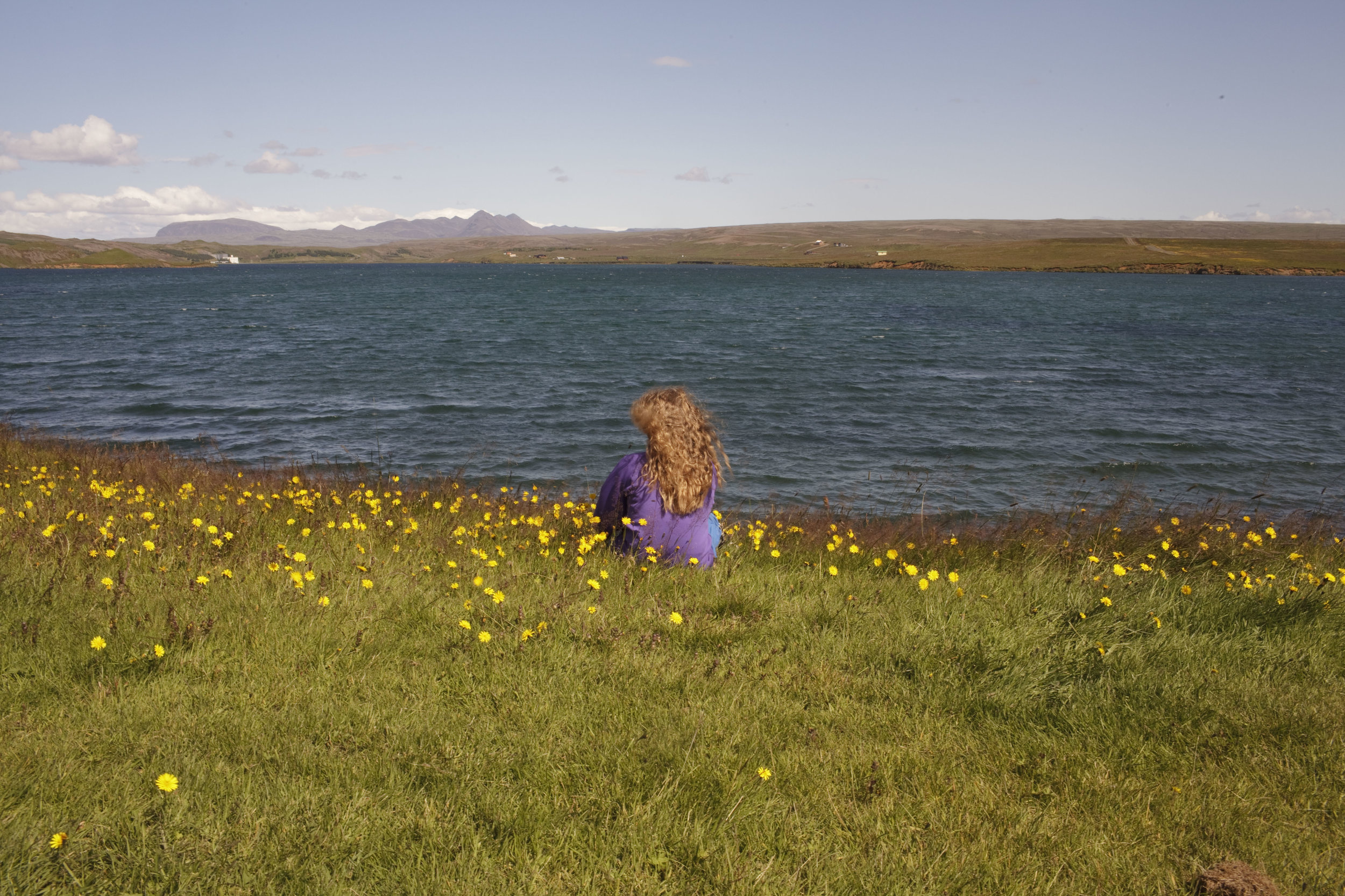  A girl looks out at the lake from the the Úlfljótsvatn camp site, 45 km from Reykjavik, where the 2012 International Scout Jamboree was held in 2012. 