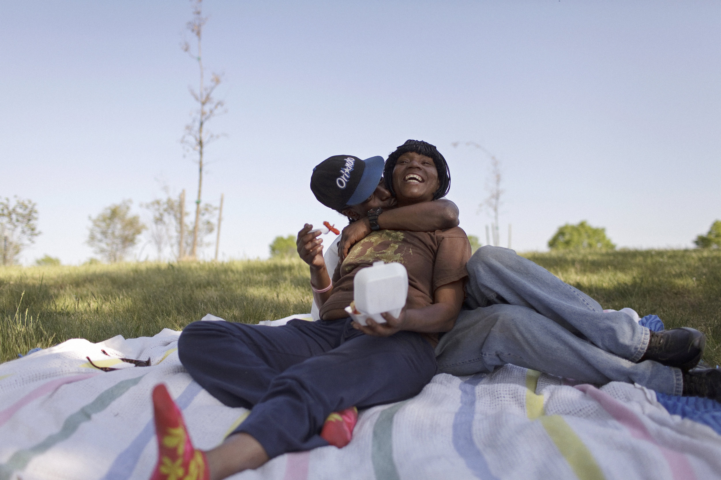 Kay Halfacre and her husband Boo enjoy the sunny afternoon on the banks of the Anacostia River, on Emancipation day, April 2012. The day before, their family caught a 60-lb catfish in the same spot. Everyone was still excited from the epic catch.