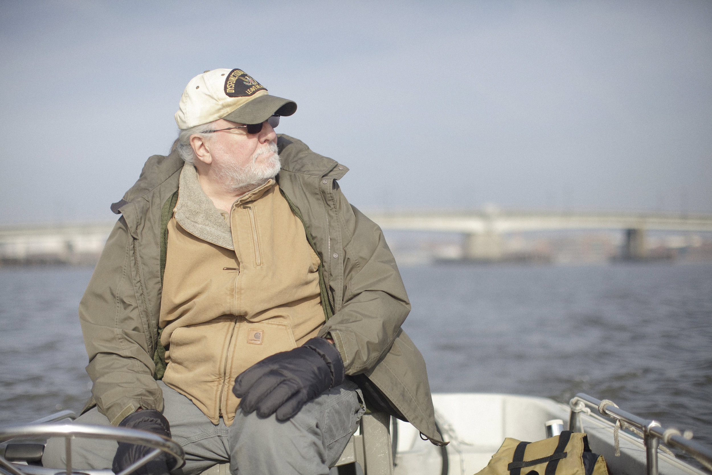 Phil Yunger, a member of Eastern Power Boat Club, the oldest power boat club in the United States, spends time on his boat on a blustery January afternoon. Yunger has a long relationship with the river-- he lived on his troller on the Anacostia for ten years and he is now married to the former Riverkeeper, Dottie Yunger.