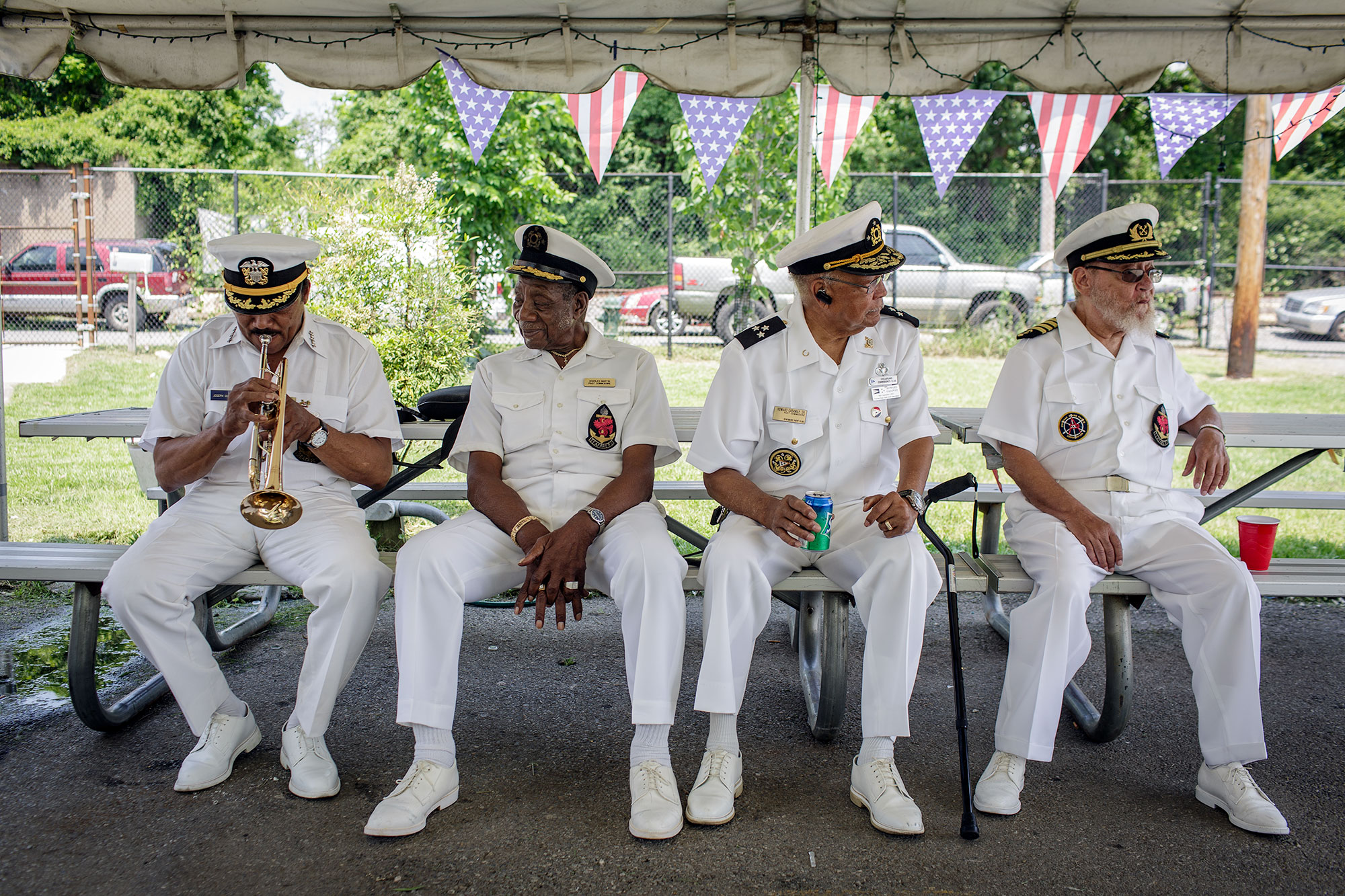  Joseph Quarterman (left), Bob Martin, Howard Gasaway, and Chubby Martin wear their Captain's uniforms as they prepare for the annual flag raising ceremony in June, 2016. 