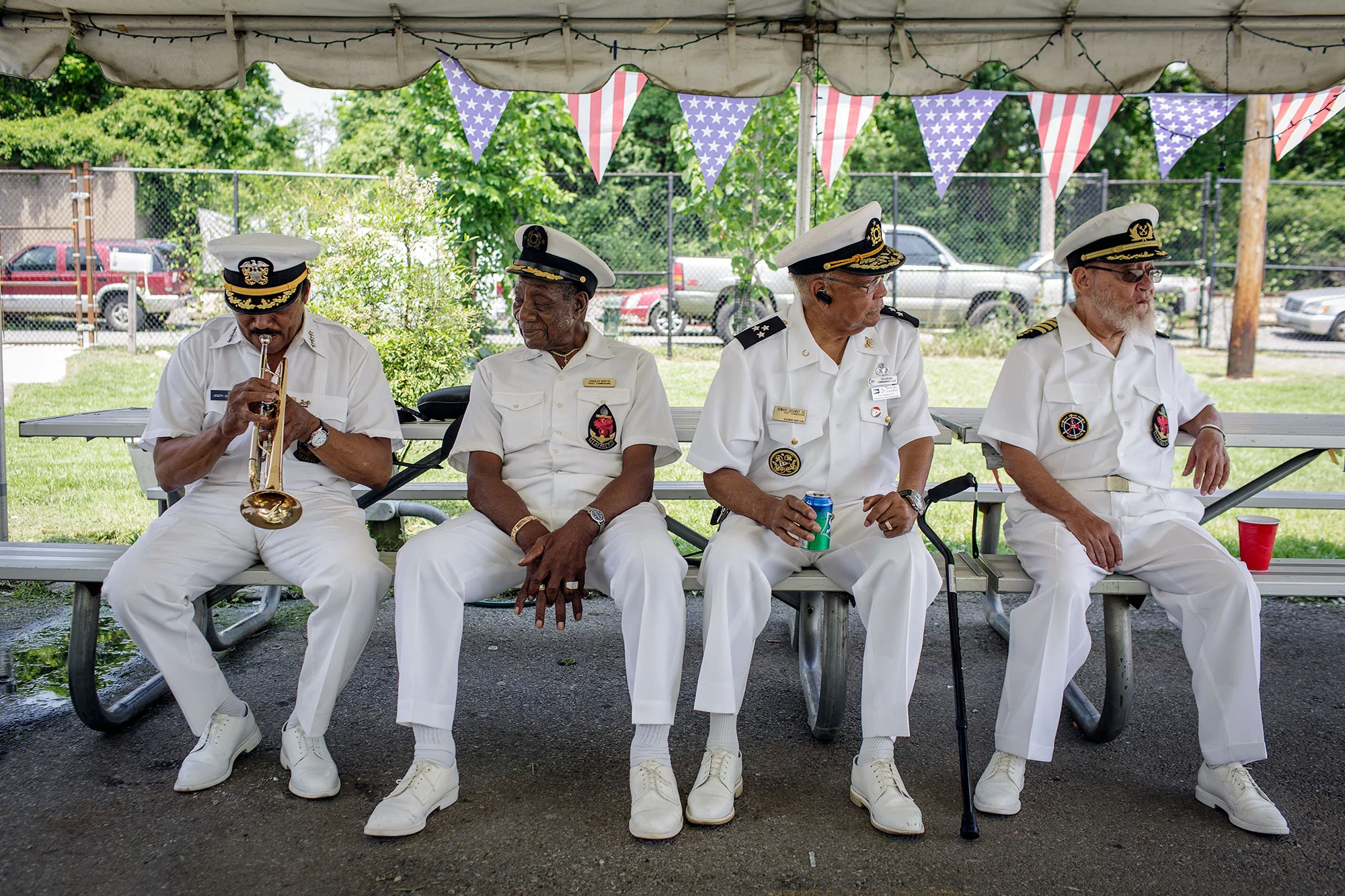Joseph Quarterman (left), Bob Martin, Howard Gasaway, and Chubby Martin wear their Captain's uniforms as they prepare for the annual flag raising ceremony in June, 2016.
