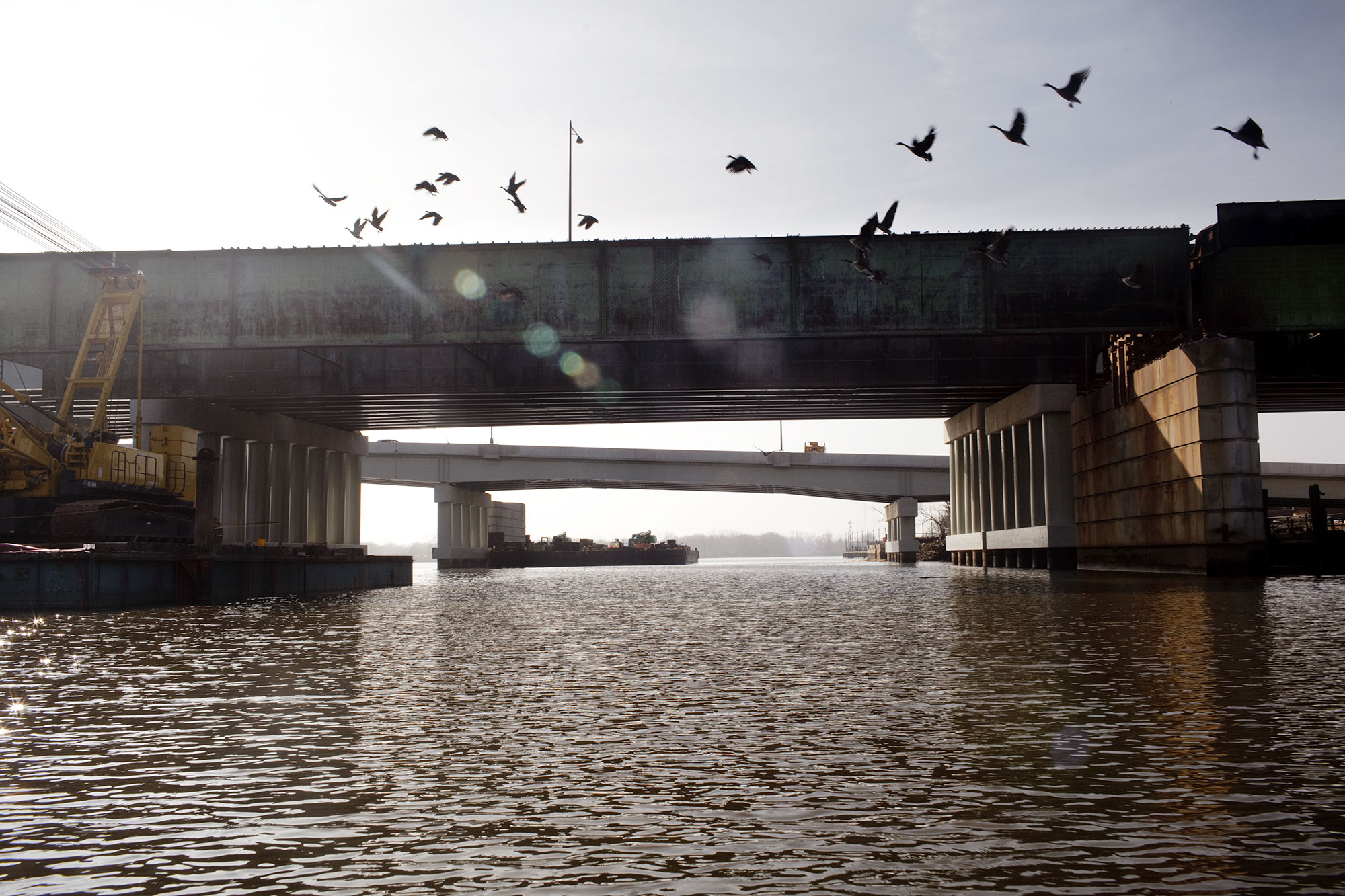  Birds flock past the 11th street bridge, which crosses the Anacostia River, connecting Capitol Hill with the historic Anacostia neighborhood. The pillars of the old 11th street bridge are the proposed site of a future elevated park that's estimated 