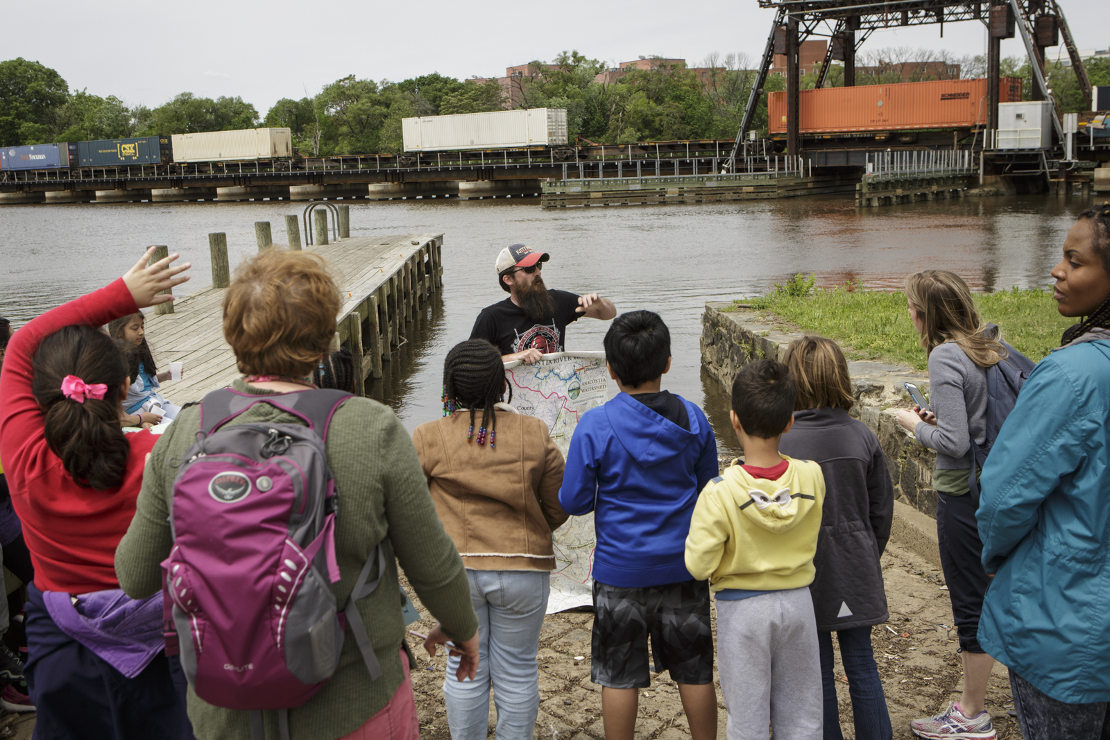 Students from Capitol City Public Charter school take part in a shad release day at the Anacostia River in Washington, D.C.