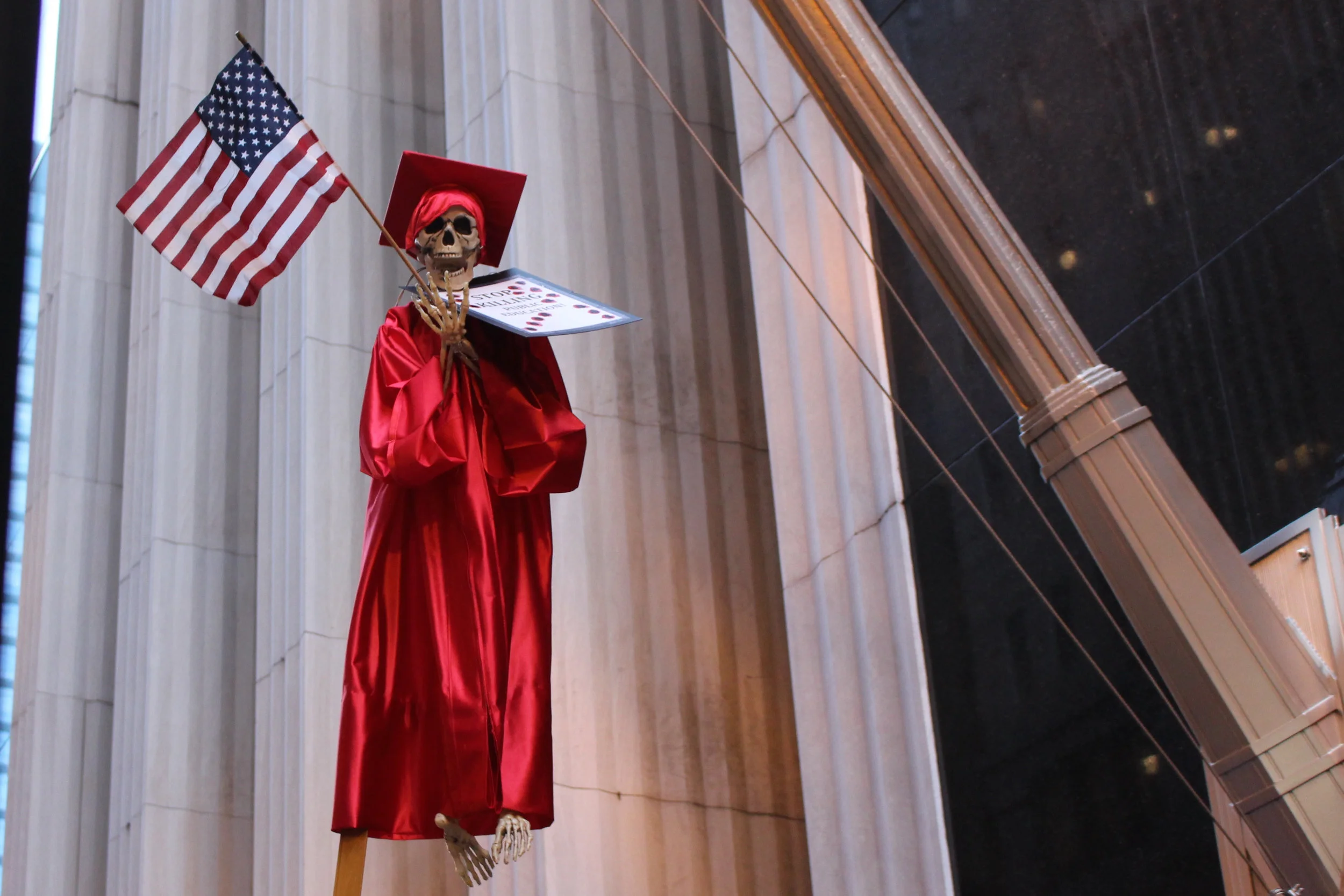 A skeleton casts an ominous figure in a Chicago Teachers Union march. (One Illinois/Ted Cox)