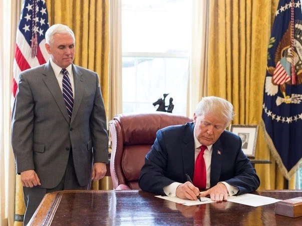 Vice President Mike Pence and President Donald Trump at a previous signing ceremony in the White House Oval Office. (Official White House Photo)