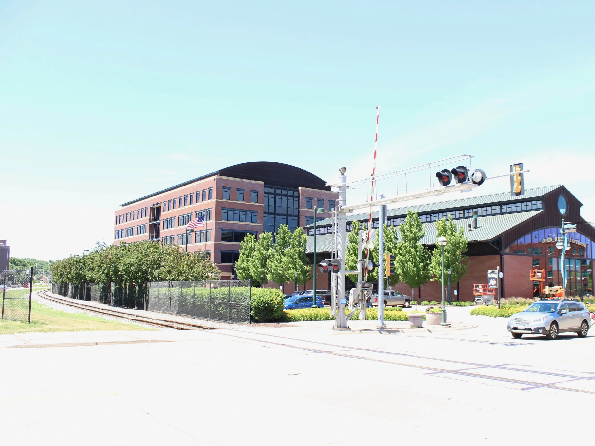 The John Deere Pavilion and other relatively recent buildings stand in wait for new Amtrak service in Moline. The new station would be at the far left across the tracks. (One Illinois/Ted Cox)