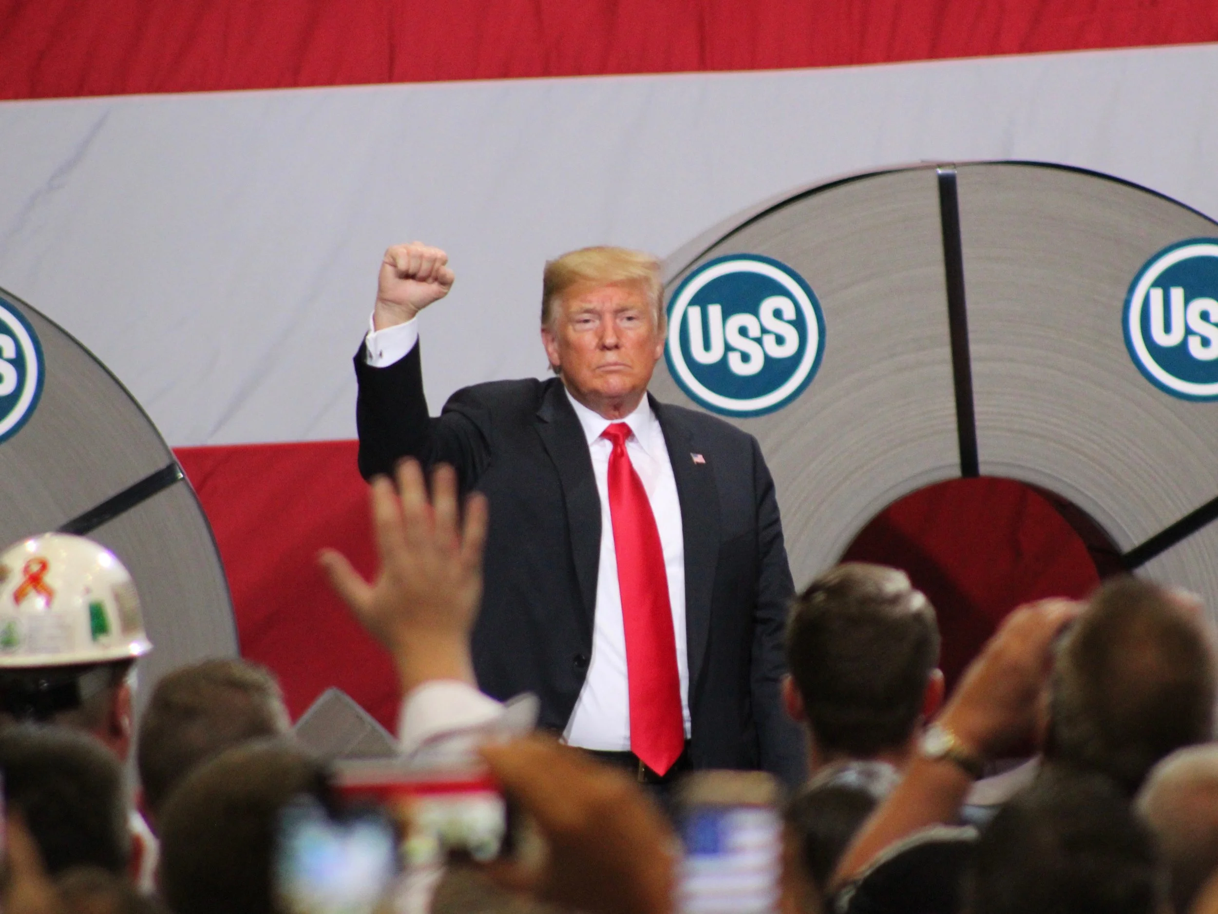 President Trump proclaims solidarity with steelworkers at the end of his speech at U.S. Steel's Granite City Works. (One Illinois/Ted Cox)