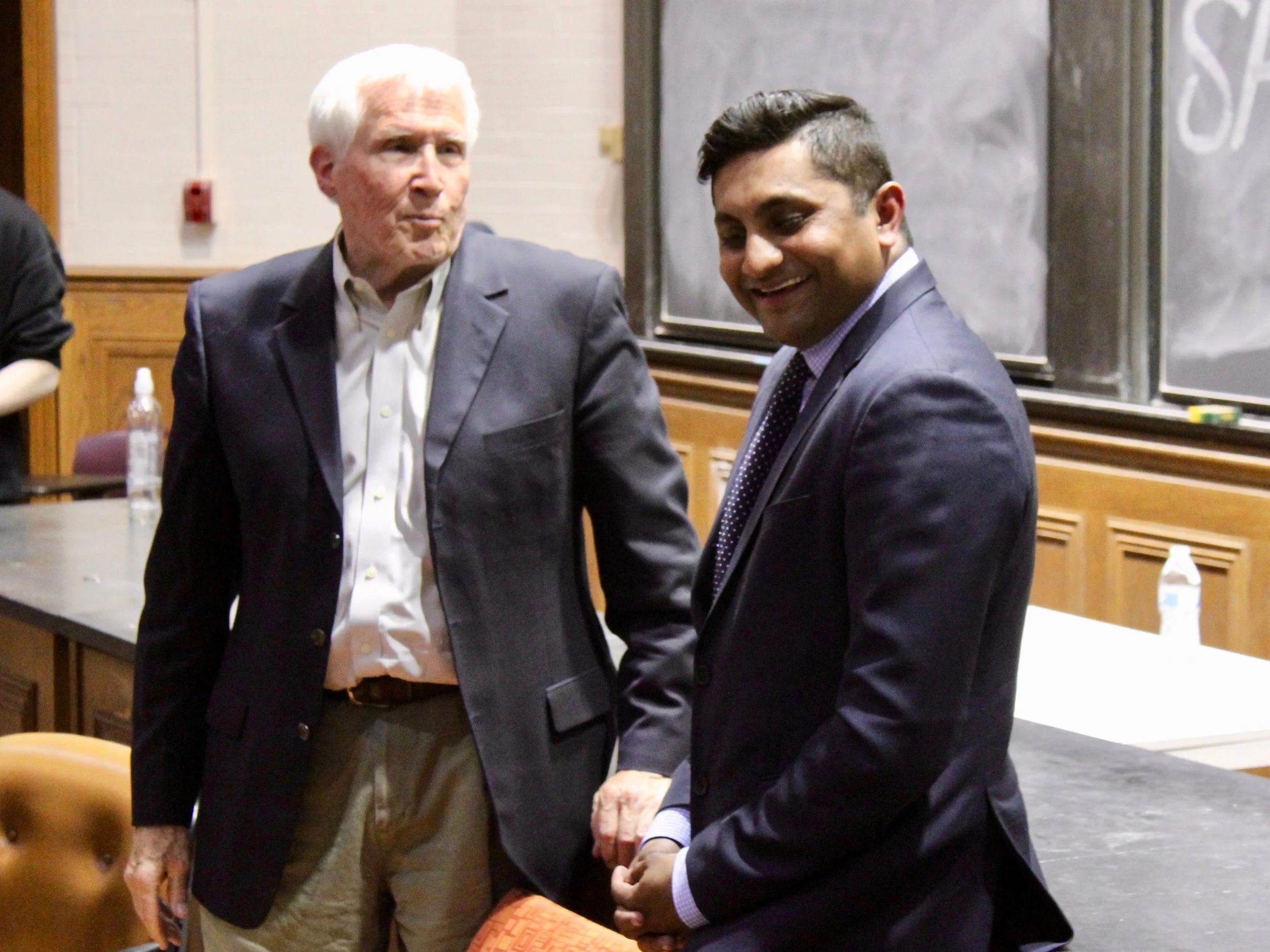 University of Chicago economist Allen Sanderson and Alderman Ameya Pawar talk after their debate in May. (One Illinois/Ted Cox)