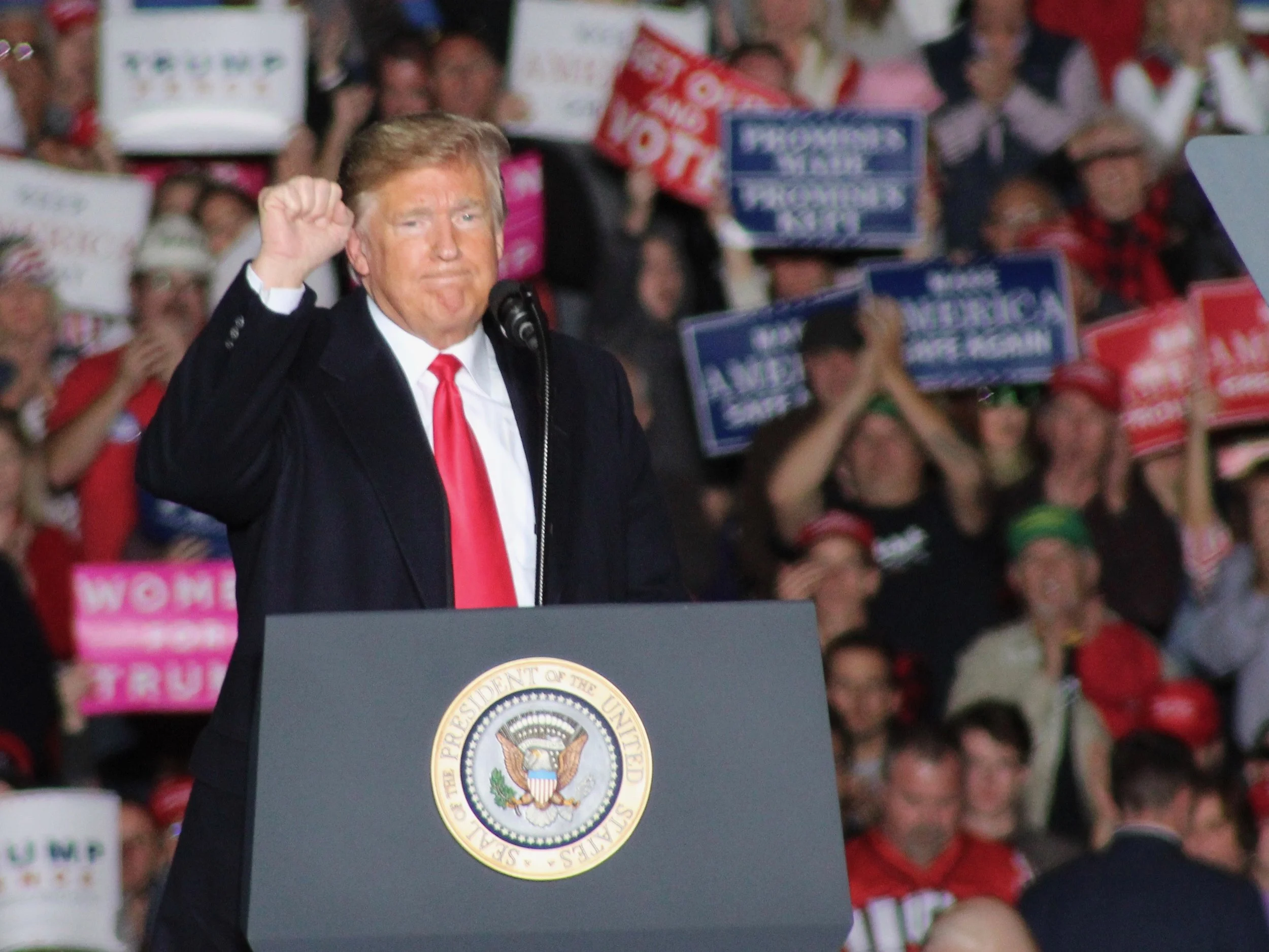 President Trump expresses solidarity with the crowd at the end of his campaign speech at Southern Illinois Airport on Saturday. (One Illinois/Ted Cox)