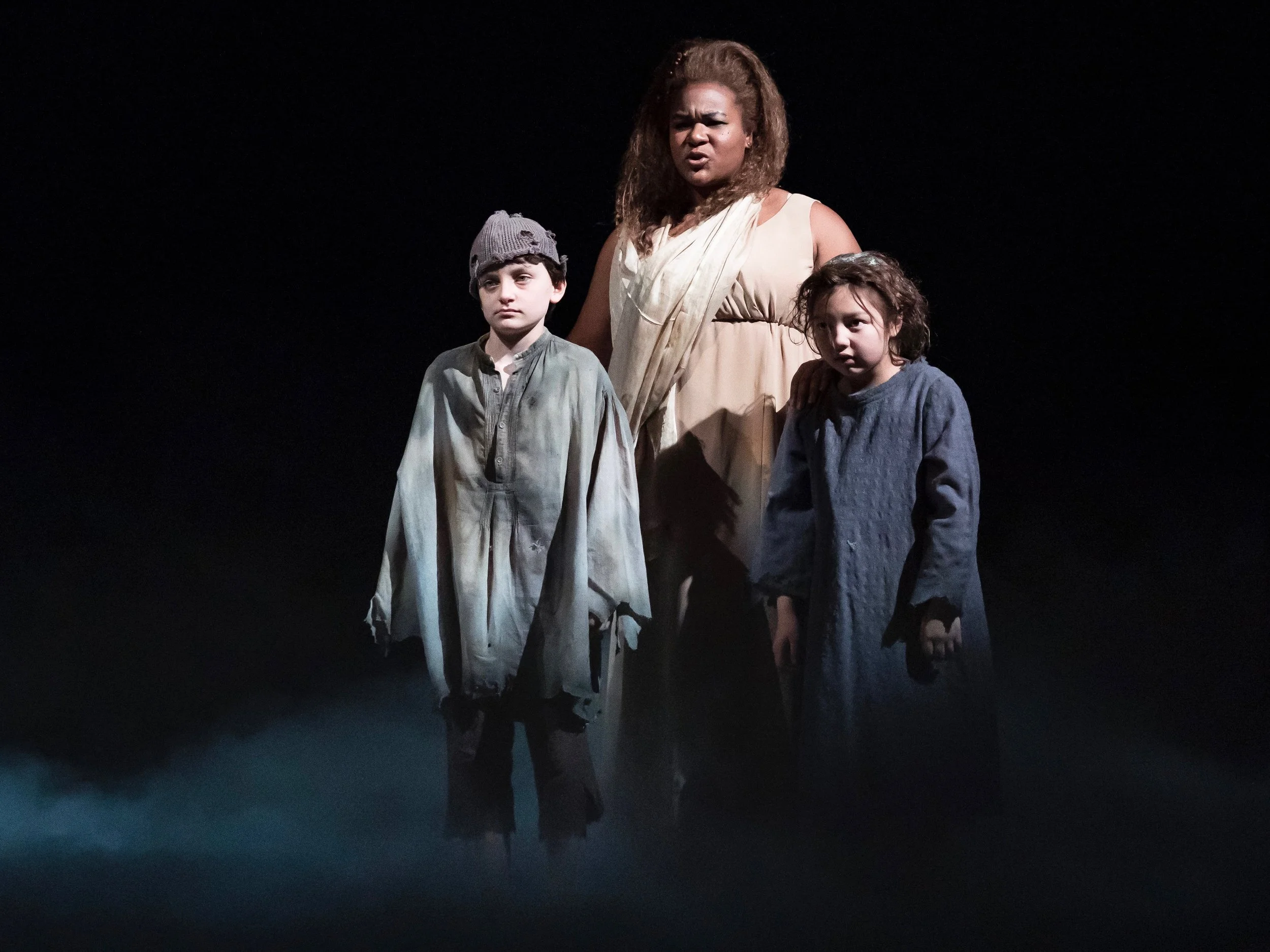 When Jasmine Bracey’s Ghost of Christmas Present reveals Ignorance (Henry Lombardo) and Want (Maggie Chong), it remains a chilling moment. (Goodman Theater)