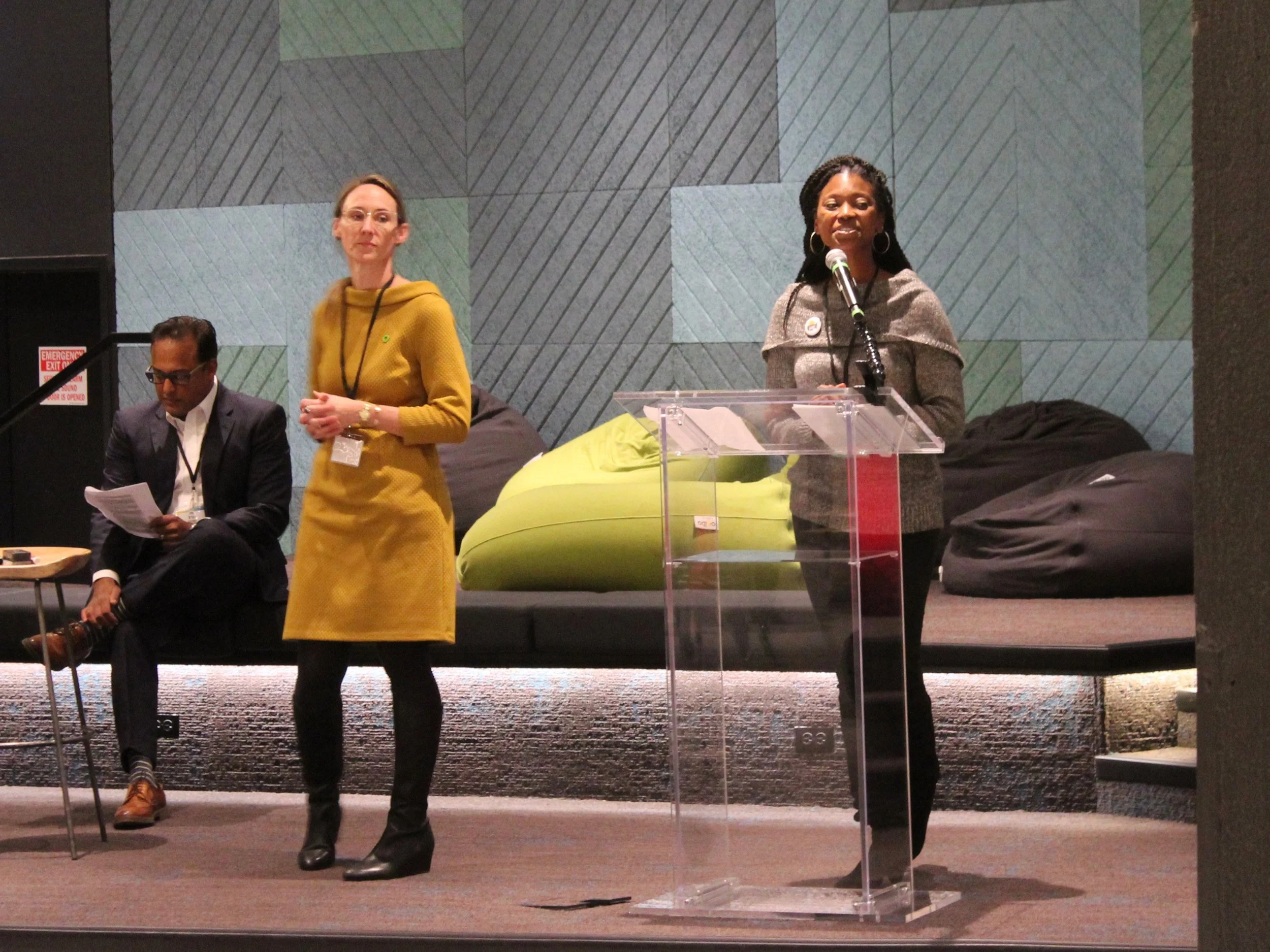 The Sierra Club’s Kyra Woods (right) is joined by WLS-TV anchor-reporter Ravi Baichwal and Jennifer Linton of the Climate Reality Project Chicago Chapter in announcing the Ready for 100 Chicago Collective. (One Illinois/Ted Cox)