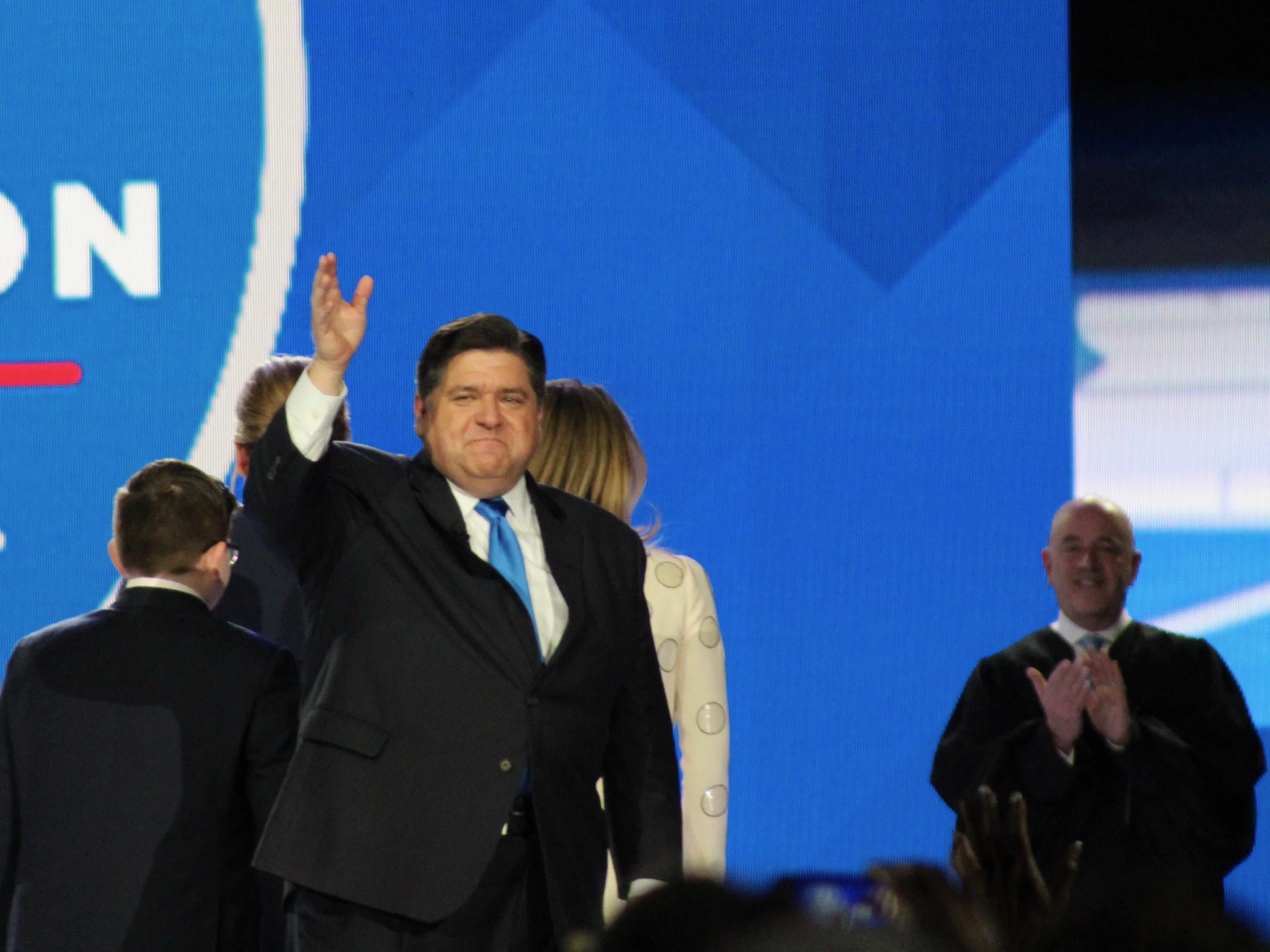 Gov. J.B. Pritzker acknowledges the crowd after taking the oath of office Monday in Springfield. (One Illinois/Ted Cox)