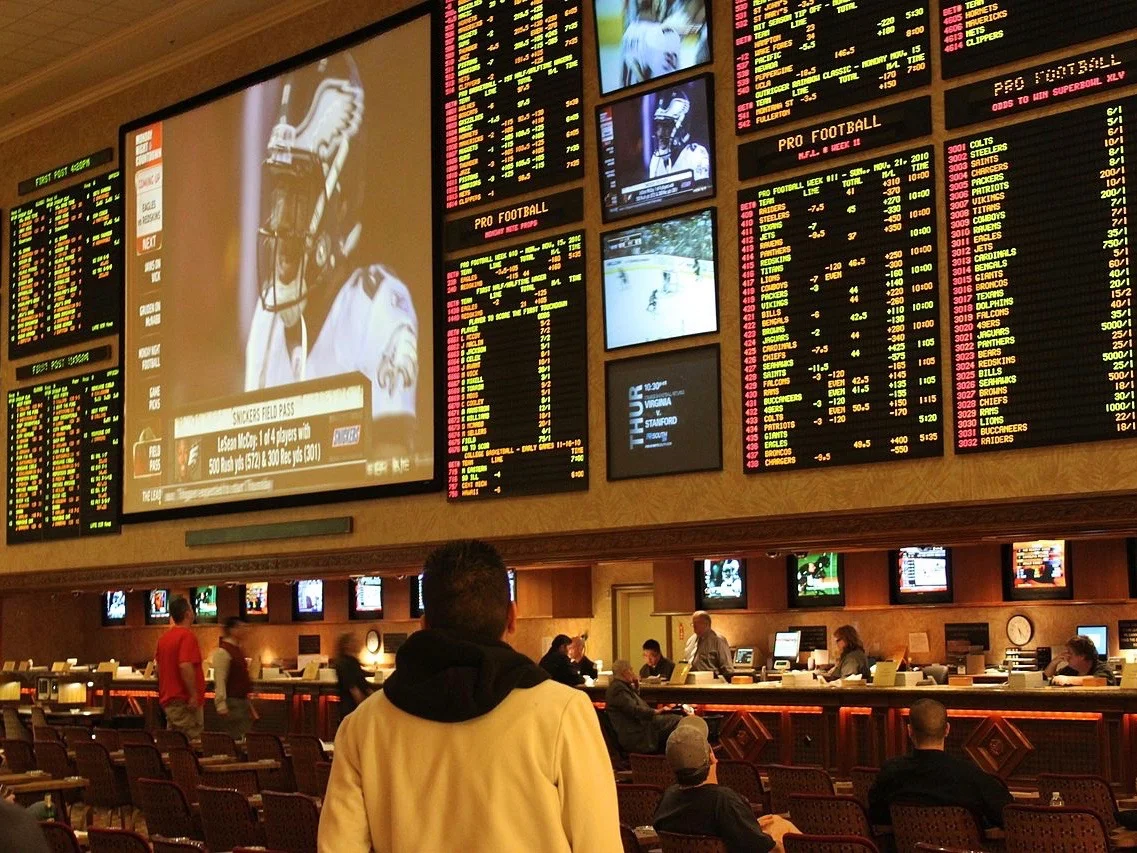 A customer sizes up a Las Vegas sports book in 2010. (Wikimedia Commons/Baishampayan Ghose)