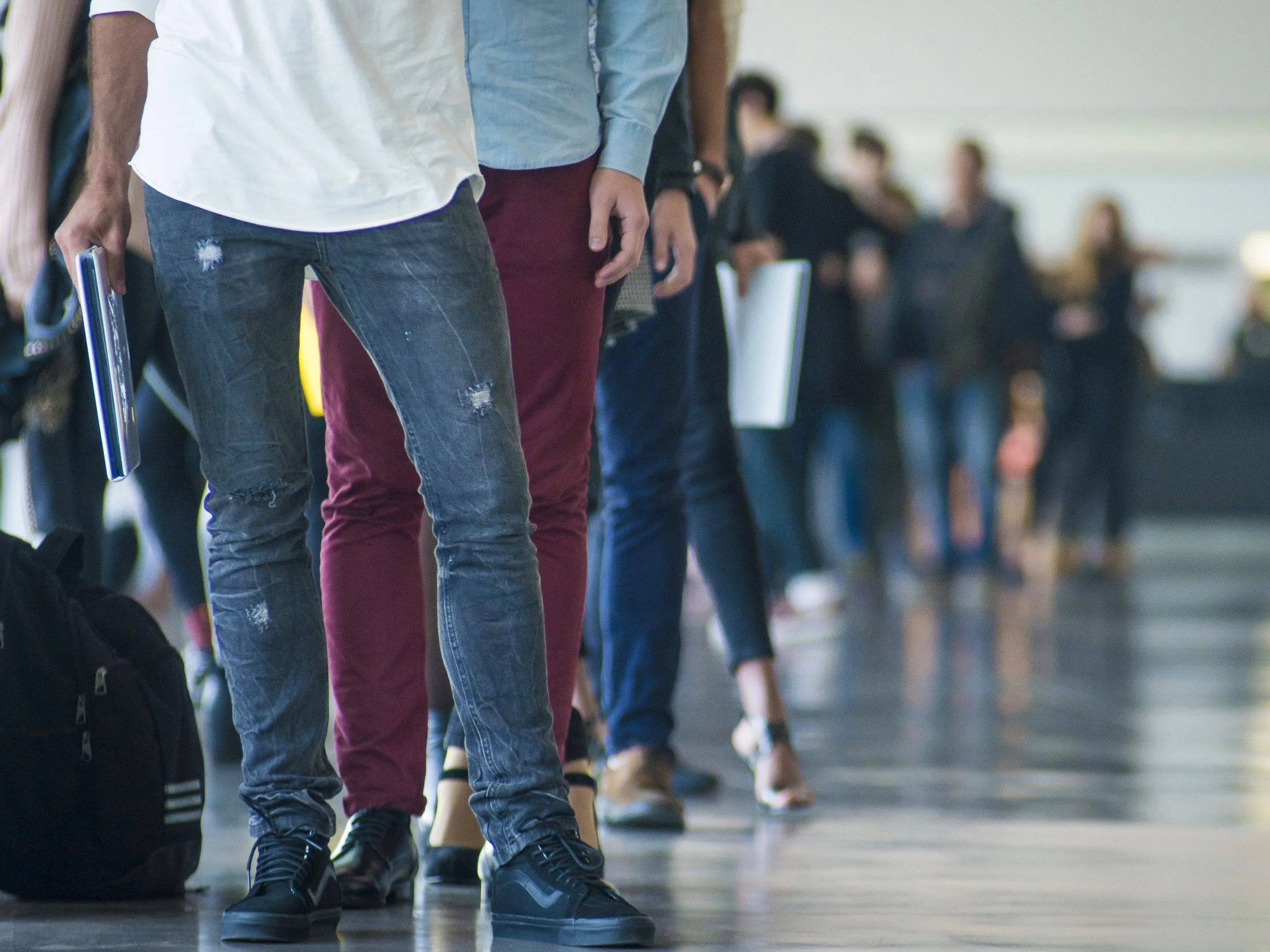 Actors stand in a job line. (Shutterstock)