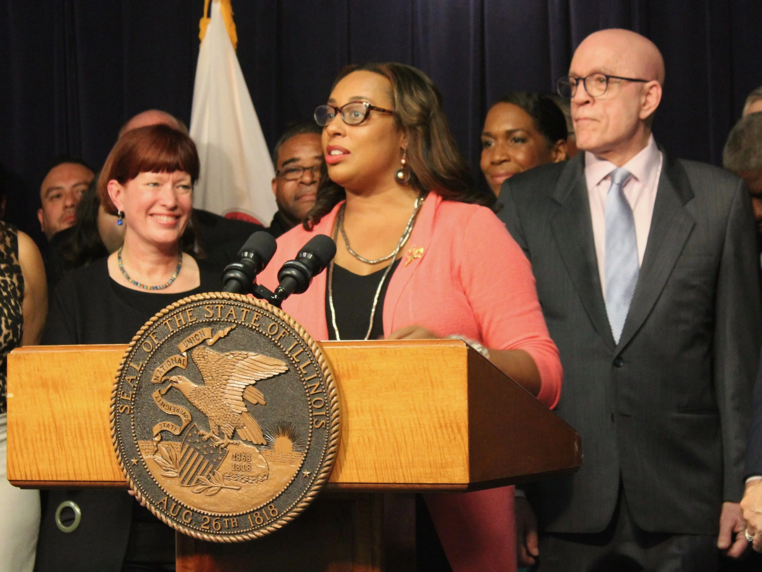 Sens. Heather Steans and Toi Hutchinson and Rep. Greg Harris joined in the signing ceremony. (One Illinois/Ted Cox)