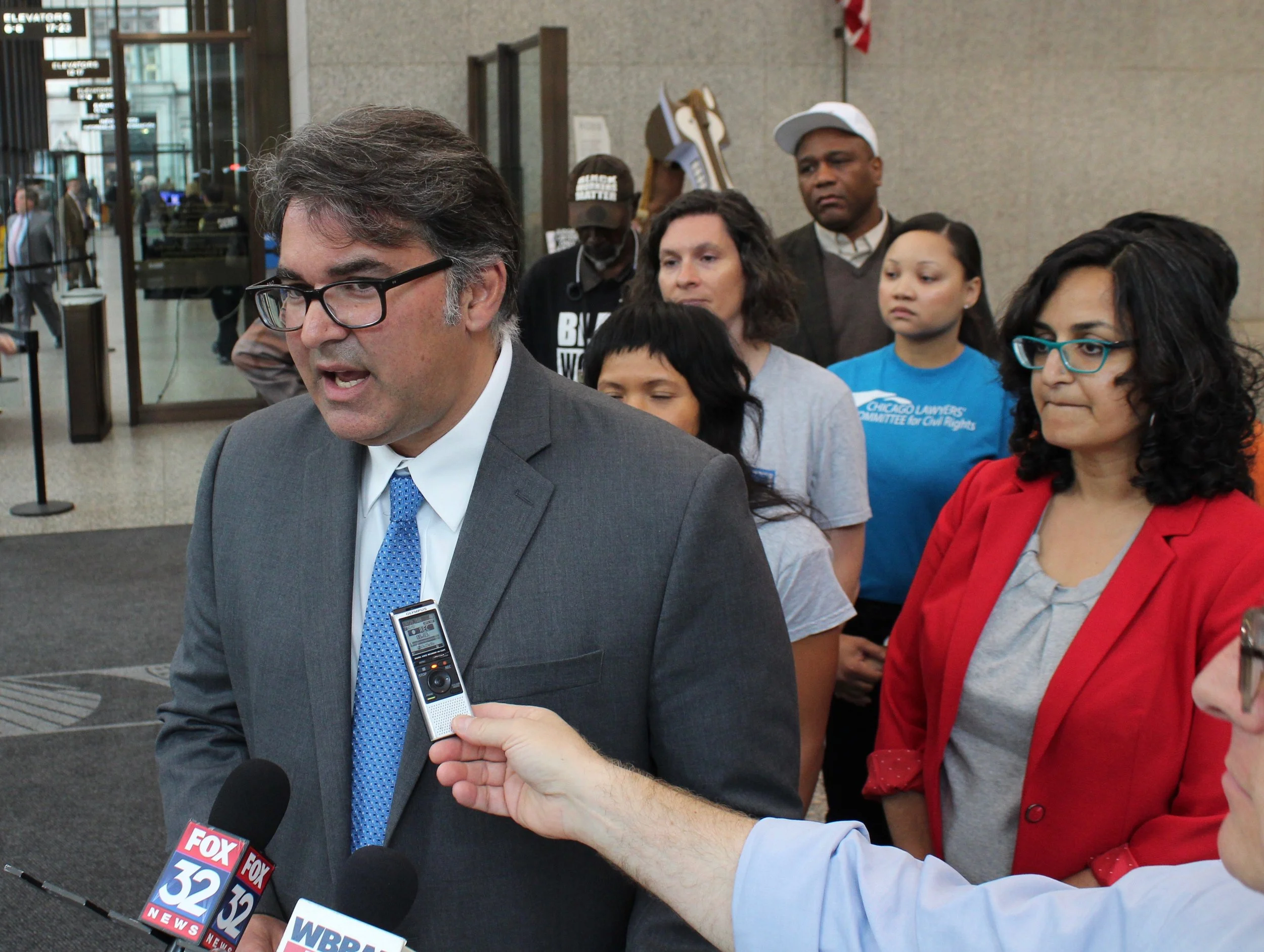 Backed by Amisha Patel of the Grassroots Collaborative (right), lawyer Aneel Chablani lays out the legal case against the Lincoln Yards TIF district. (One Illinois/Ted Cox)
