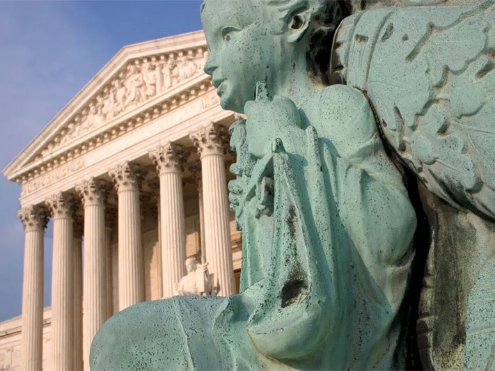 The U.S. Supreme Court found the scales of justice tipping back and forth in a pair of controversial rulings on Thursday. (Flickr/Justin)