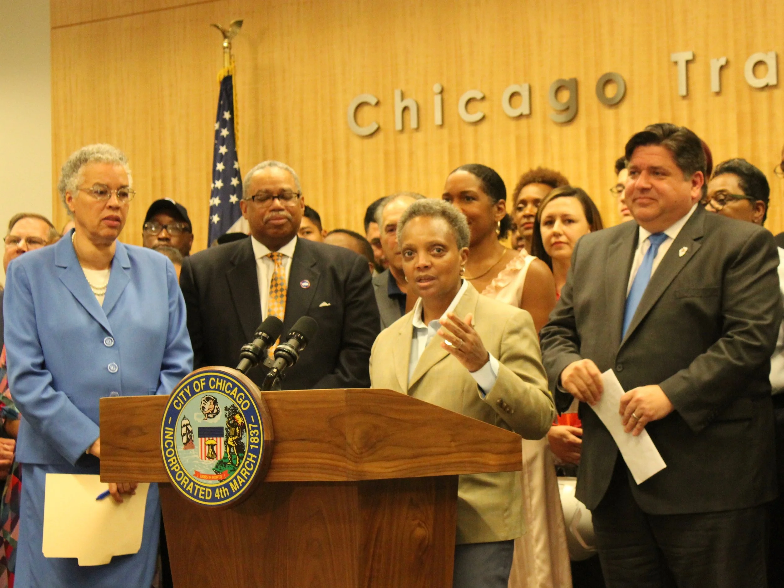 With Cook County Board President Toni Preckwinkle and CTA President Dorval Carter looking on, Chicago Mayor Lori Lightfoot and Gov. J.B. Pritzker discuss how the Rebuild Illinois capital plan will improve mass transit. (One Illinois/Ted Cox)