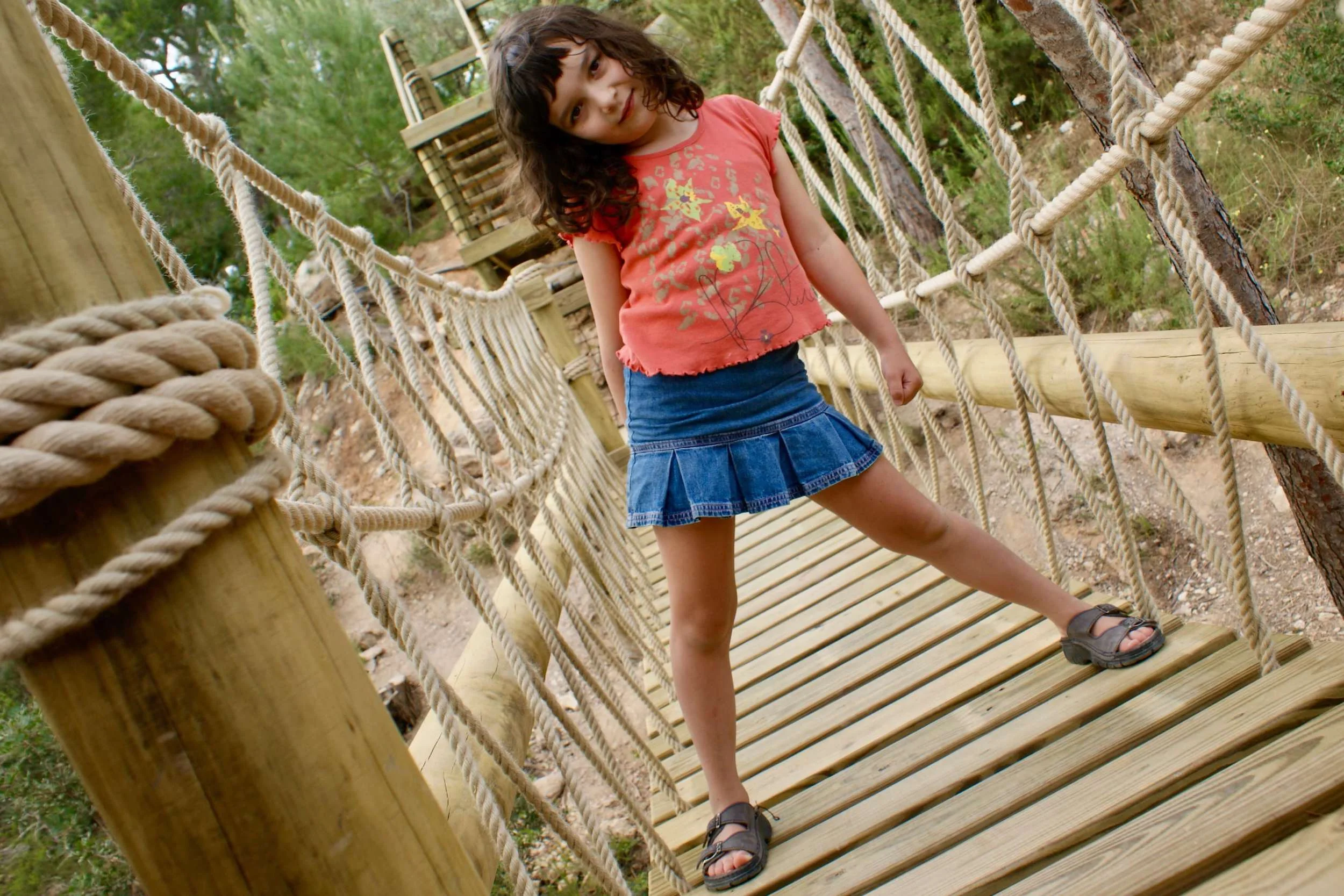 Girl with adventure attitude of Rope Bridge